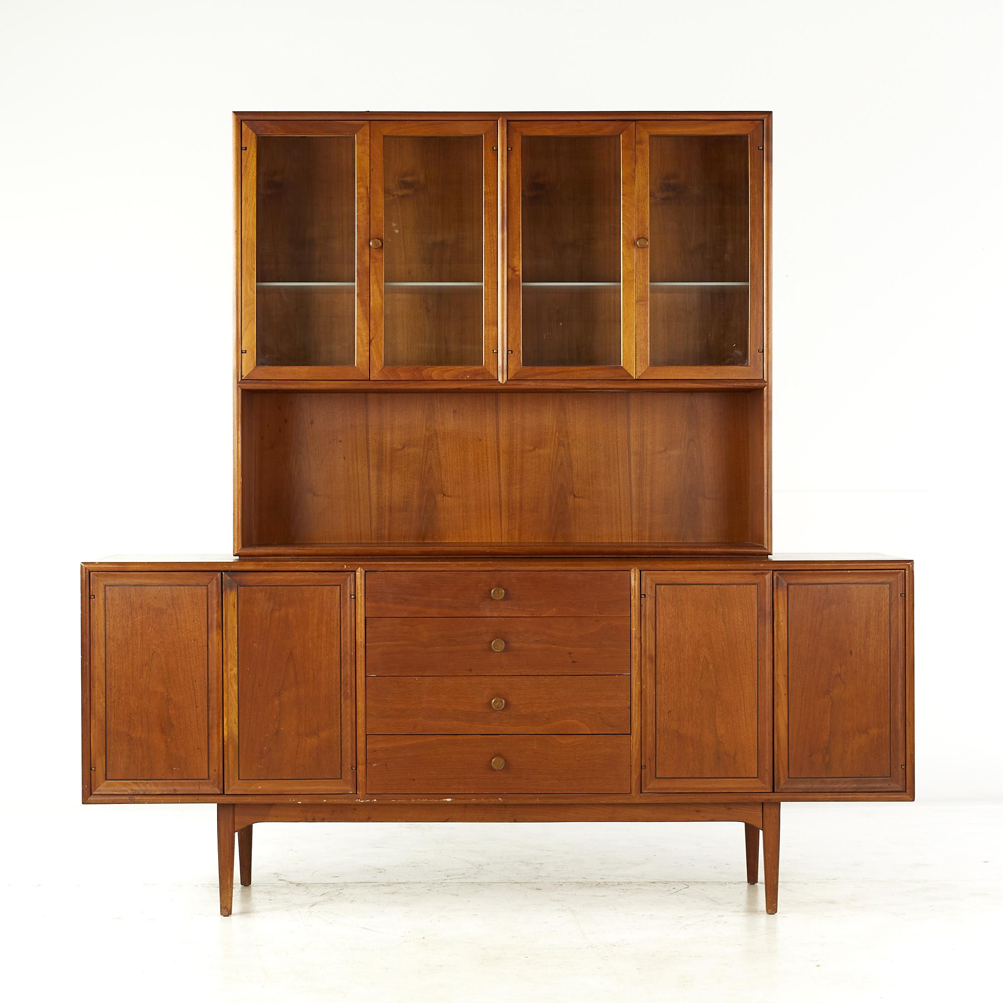 Kipp Stewart for Drexel declaration mid century walnut buffet with hutch.

The buffet measures: 72.25 wide x 20 deep x 31 inches high
The hutch measures: 48.5 wide x 12 deep x 40 inches high
The combined height of the buffet and hutch is