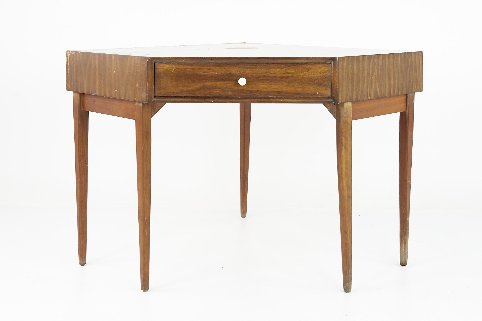 Kipp Stewart for Drexel declaration mid century walnut corner desk

This desk measures: 52.5 wide x 40.25 deep x 31.5 inches high, with a chair clearance of 22.5 inches

?All pieces of furniture can be had in what we call restored vintage