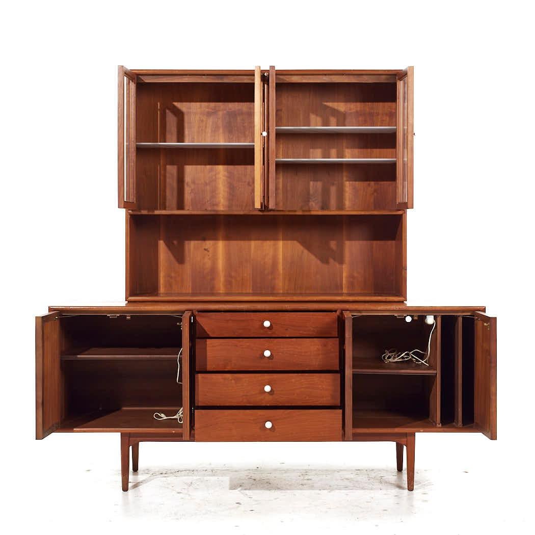 Kipp Stewart for Drexel Declaration Mid Century Walnut Credenza and Hutch

The credenza measures: 72.25 wide x 20 deep x 31.25 inches high
The hutch measures: 48.5 wide x 12 deep x 40 inches high
The combined height of the credenza and hutch is