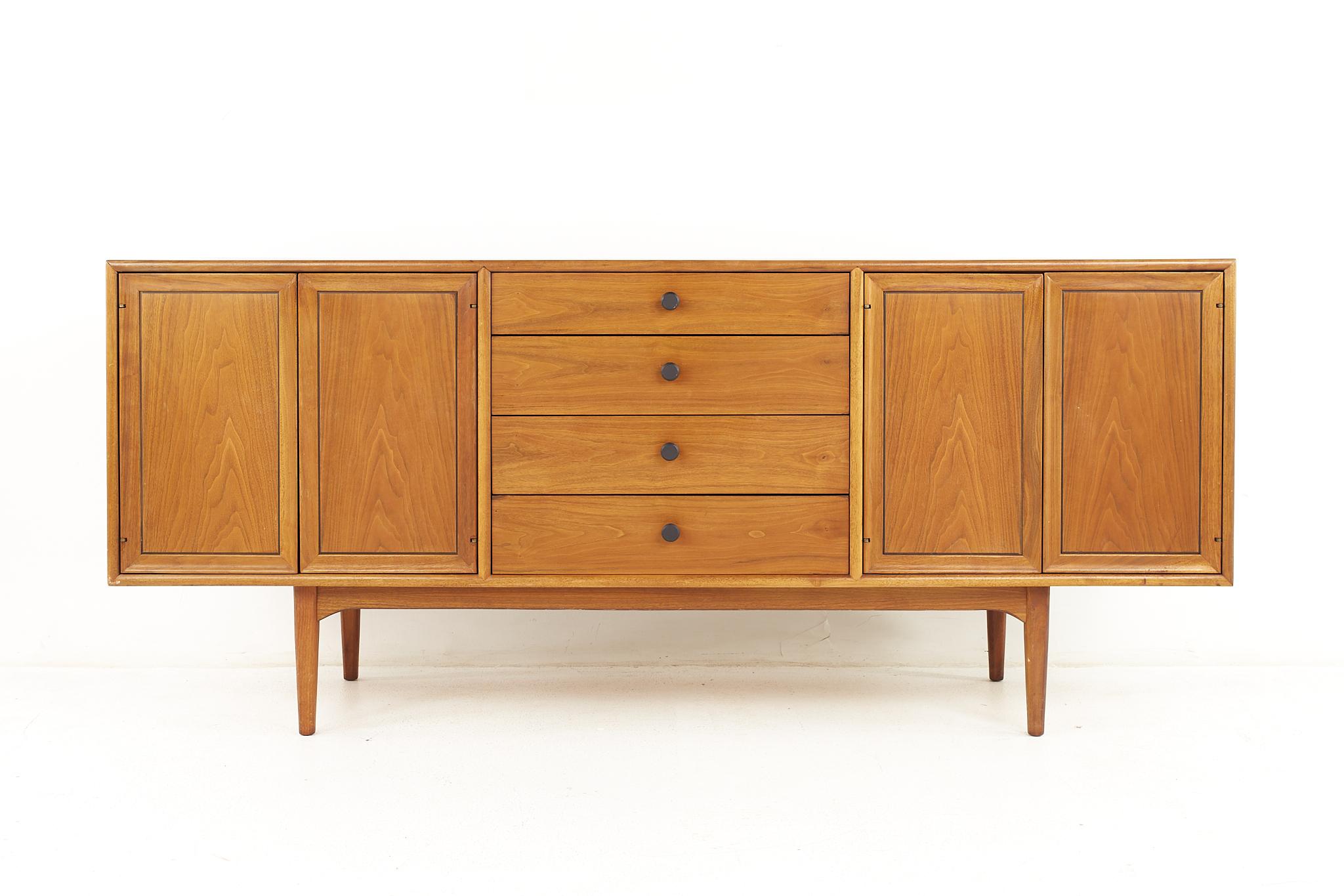 Kipp Stewart for Drexel Declaration mid century walnut credenza.

The credenza measures: 72.25 wide x 20 deep x 31 inches high. 

All pieces of furniture can be had in what we call restored vintage condition. That means the piece is restored