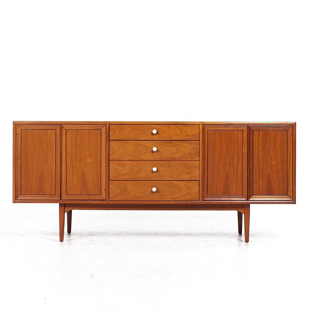 Kipp Stewart for Drexel Declaration Mid Century Walnut Credenza

This credenza measures: 72.25 wide x 20 deep x 31.25 inches high

All pieces of furniture can be had in what we call restored vintage condition. That means the piece is restored upon
