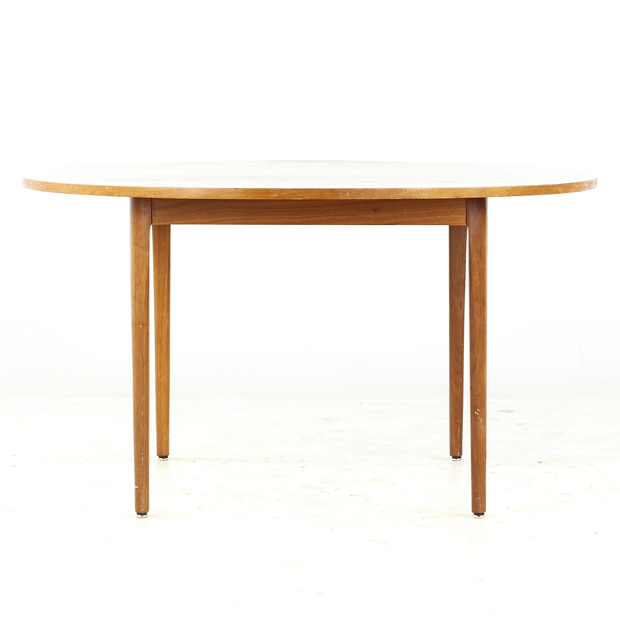 Kipp Stewart for Drexel Declaration midcentury Walnut Dining Table

This dining table measures: 47.25 wide x 47.25 deep x 26.25 high, with a chair clearance of 25.5 inches

All pieces of furniture can be had in what we call restored vintage