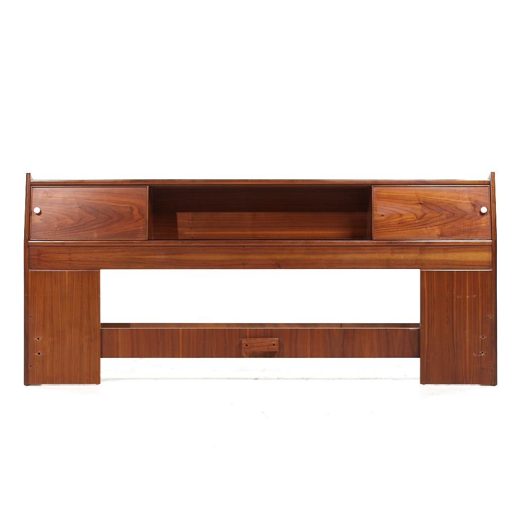 Kipp Stewart for Drexel Declaration Mid Century Walnut King Storage Headboard

This headboard measures: 79 wide x 10 deep x 36 inches high

All pieces of furniture can be had in what we call restored vintage condition. That means the piece is