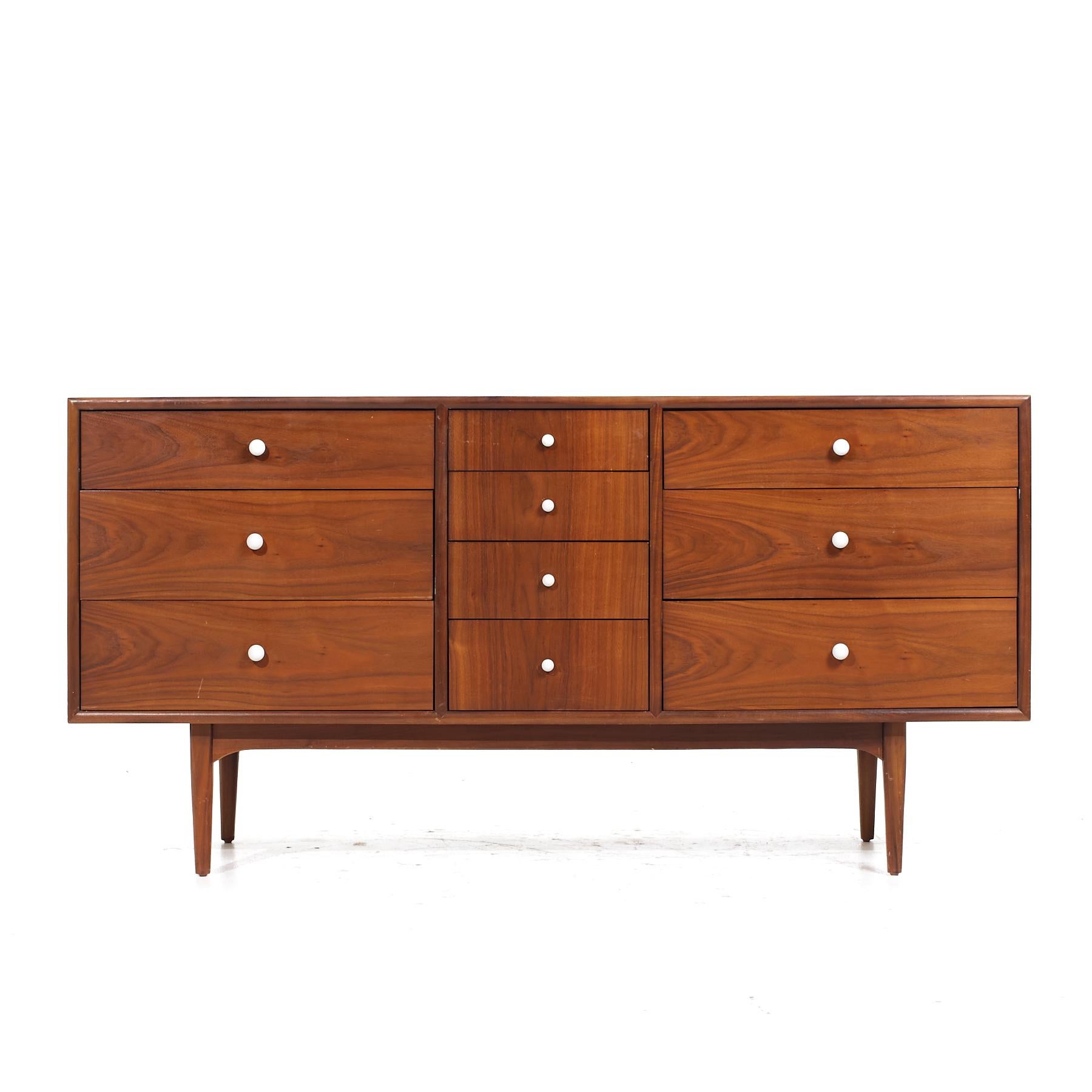 Kipp Stewart for Drexel Declaration Mid Century Walnut Lowboy Dresser

This lowboy measures: 62 wide x 20 deep x 31.25 inches high

All pieces of furniture can be had in what we call restored vintage condition. That means the piece is restored upon
