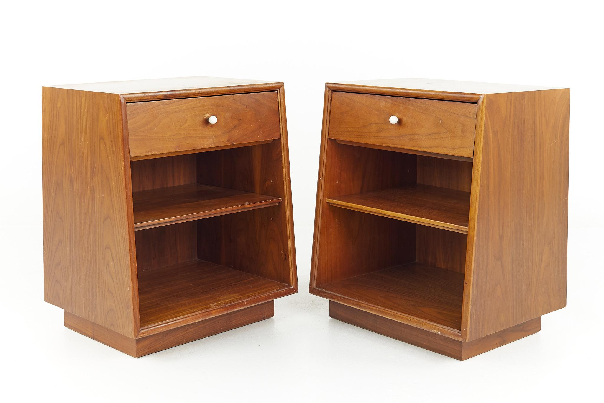 Kipp Stewart for Drexel Declaration mid century walnut nightstands - a pair

Each nightstand measures: 20 wide x 16 deep x 24.25 inches high

All pieces of furniture can be had in what we call restored vintage condition. That means the piece is