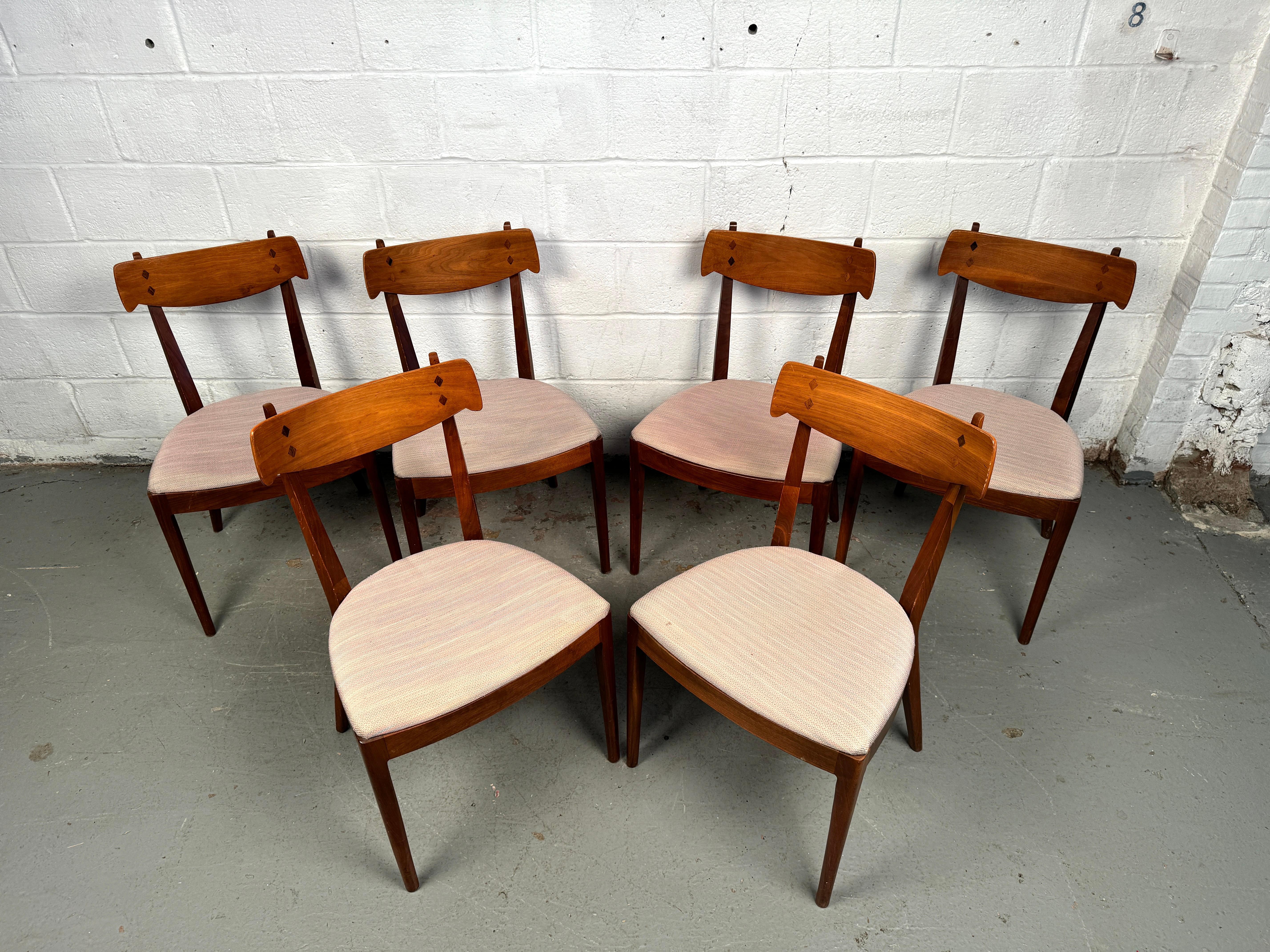 Celebrate the elegance of American mid-century design with this stunning set of Six 