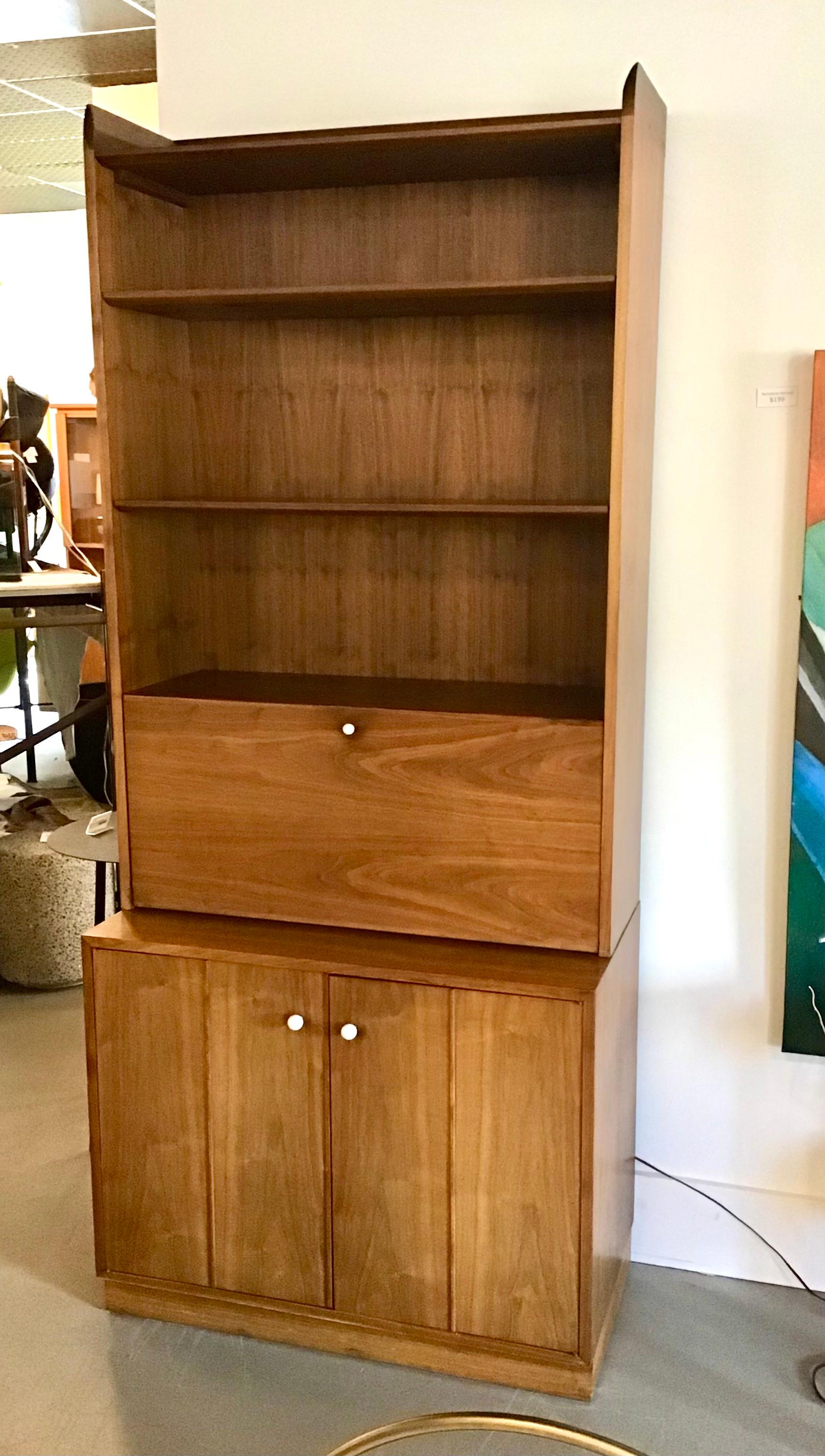A unique and handsome Kipp Stewart for Drexel Declaration piece of furniture that can serve a multitude of uses as a desk, bar or bookshelf.

Measurements: 84