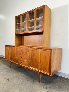 Kipp Stewart for Drexel Declaration Two Piece Walnut Credenza Circa 1960s