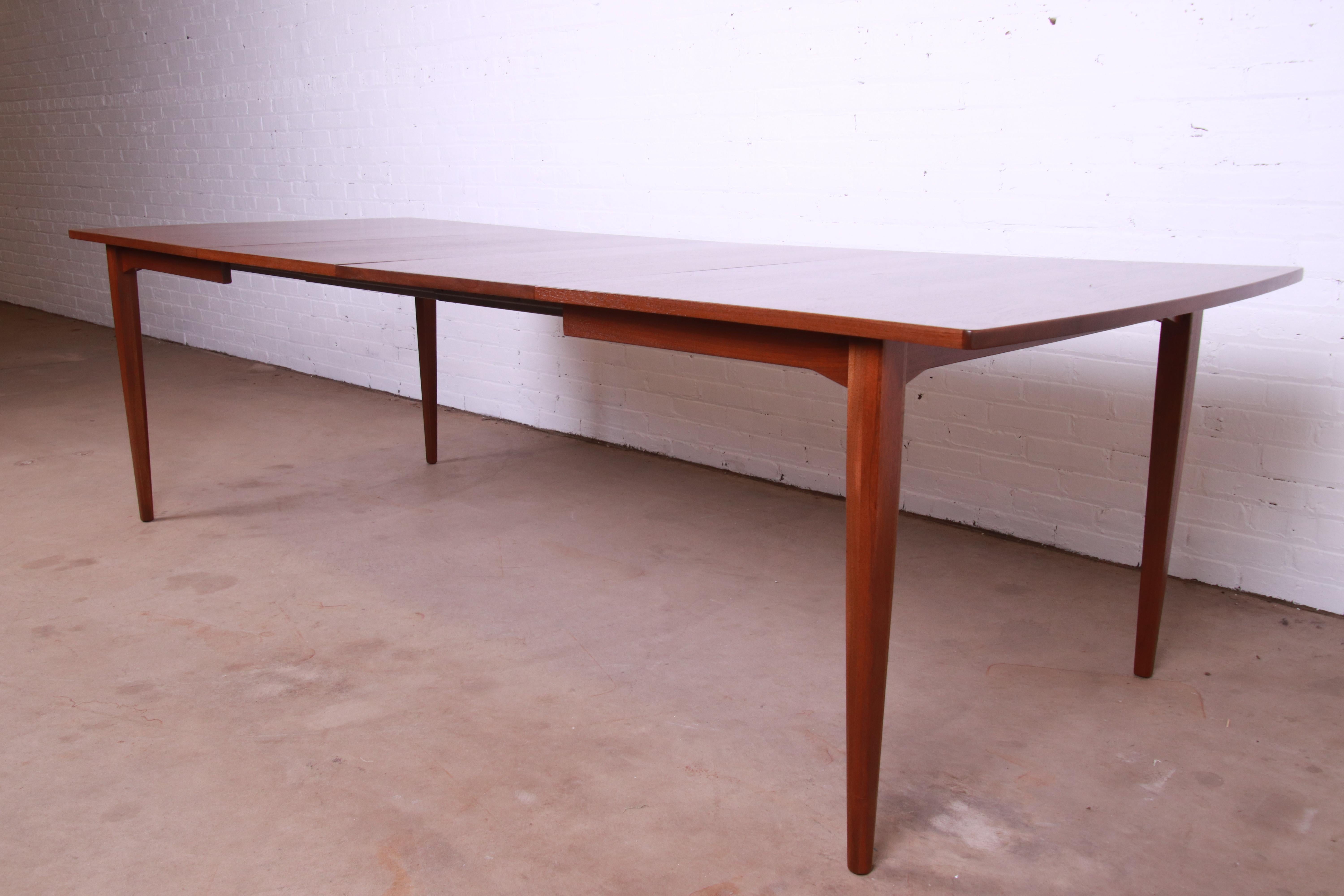 A gorgeous Mid-Century Modern walnut extension dining table

By Kipp Stewart for Drexel, 