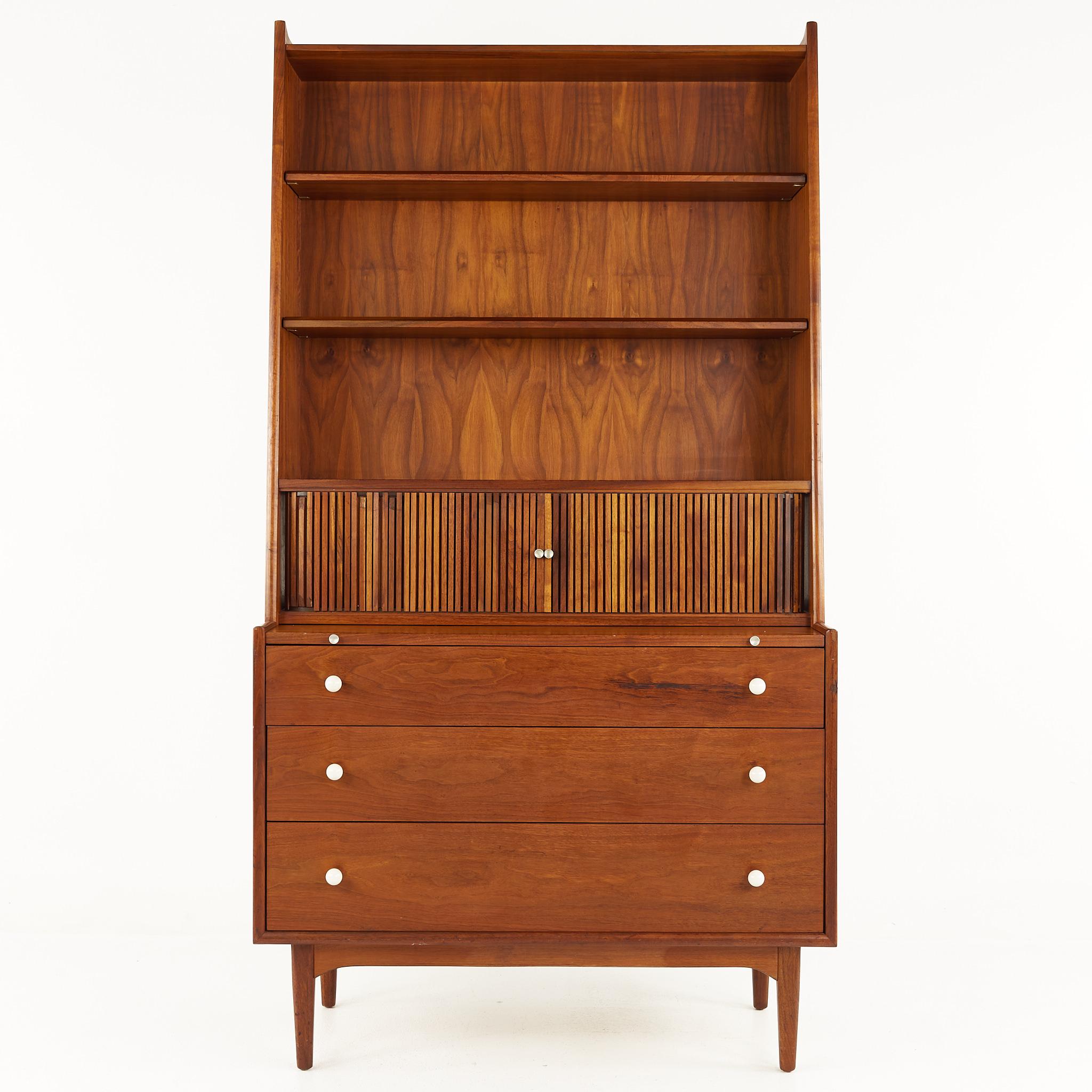 Kipp Stewart for Drexel Declarations Mid Century Walnut Tambour Bookcase Secretary Desk

The bookcase measures: 38 wide x 18.25 deep x 71.25 inches high

All pieces of furniture can be had in what we call restored vintage condition. That means