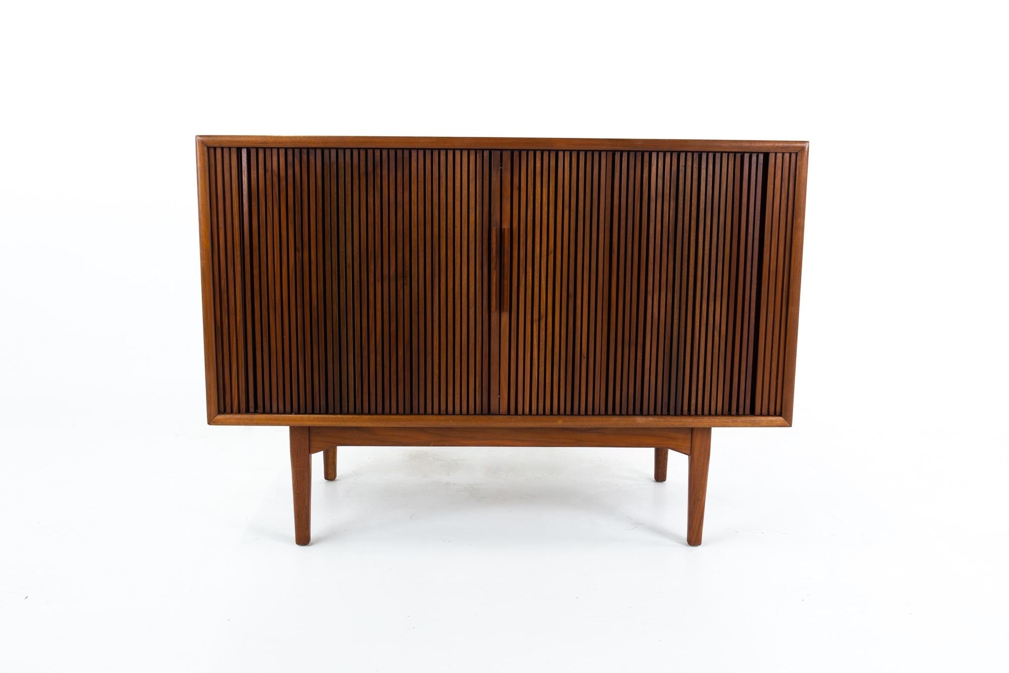 Kipp Stewart for Drexel declarations Mid Century walnut tambour door sideboard credenza
Credenza measures: 43.5 wide x 20 deep x 31 inches high

This price includes getting this piece in what we call restored vintage condition. That means the piece