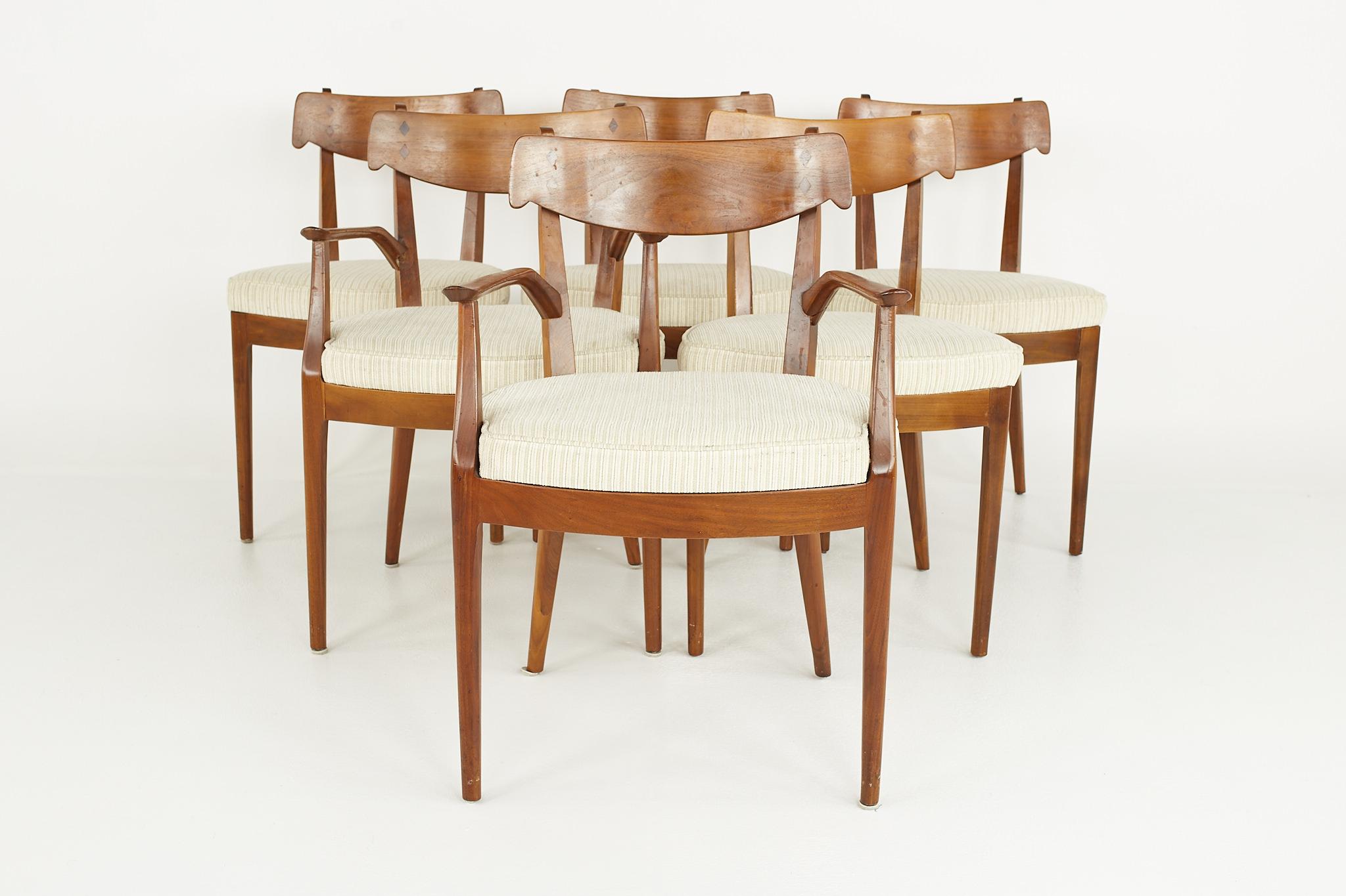 Kipp Stewart for Drexel Mid Century Walnut Dining Chairs - Set of 6

Each chair measures: 21.25 wide x 20.5 deep x 32 high, with a seat height of 19 inches and arm height of 26 inches

?All pieces of furniture can be had in what we call restored