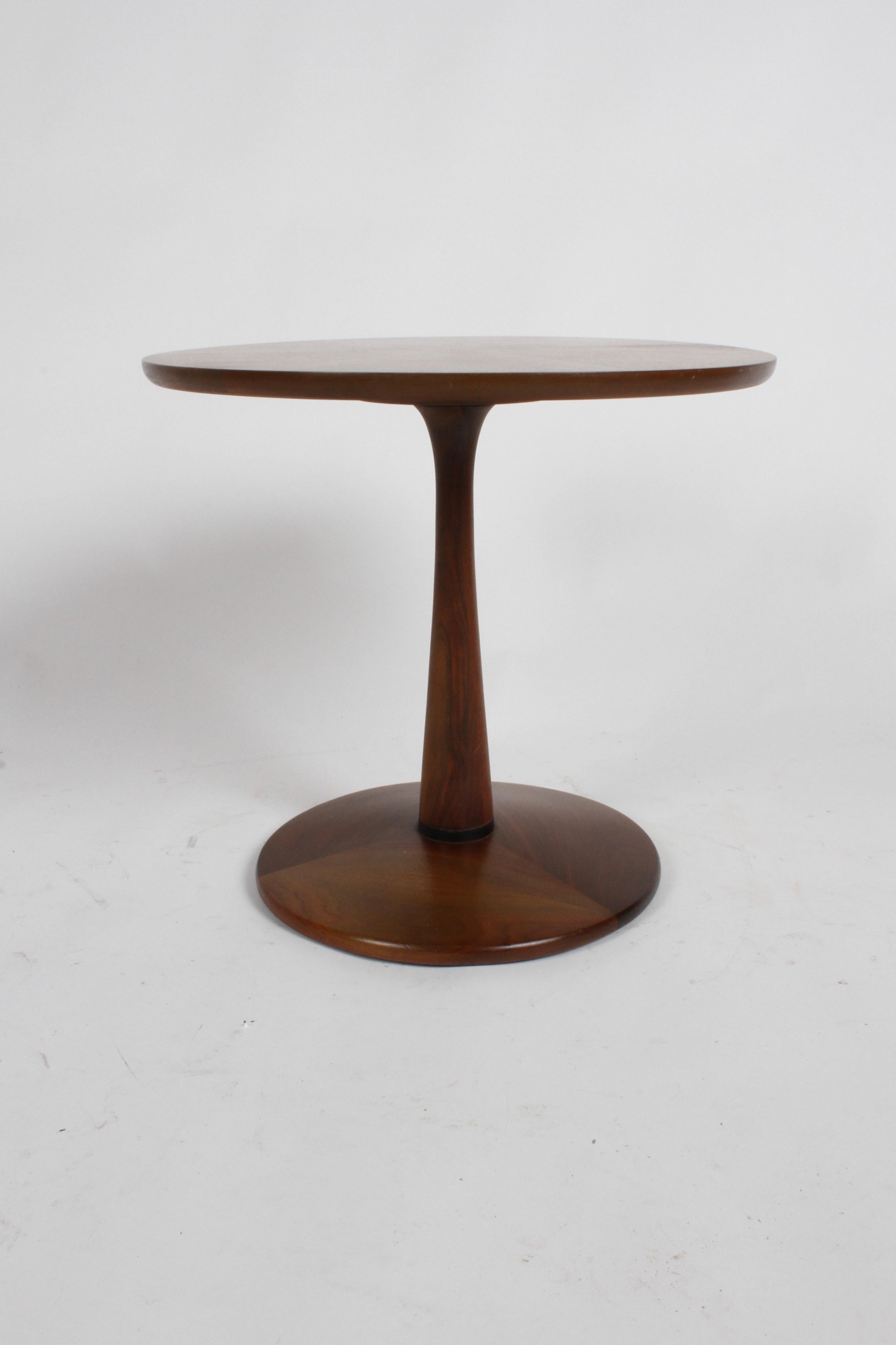 Kipp Stewart for Drexel side, end or drinks table designed as part of their declaration line. This table has beautifully bookmatched walnut veneer on the top and a graceful pedestal base. Stamped on the bottom declaration by Drexel and date of