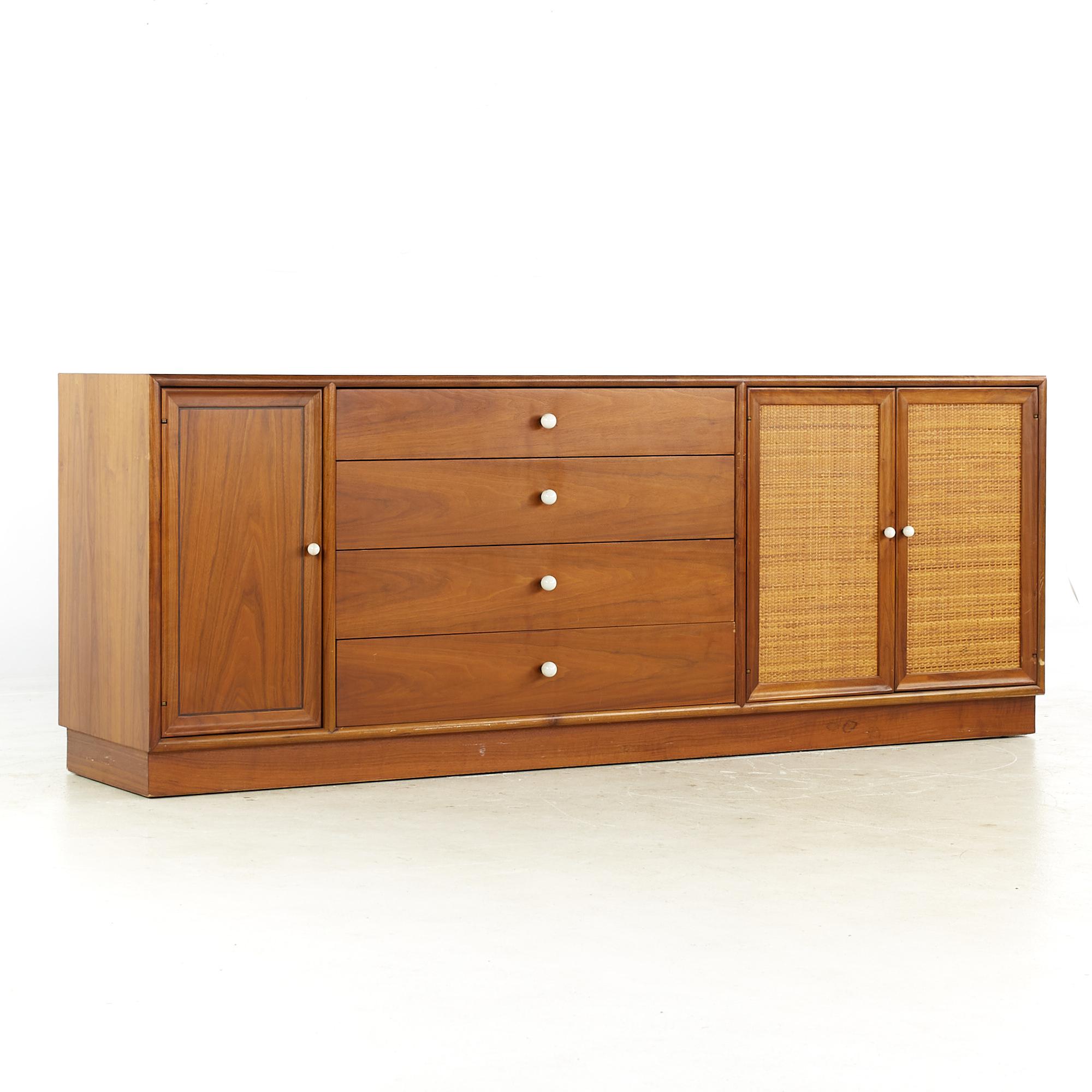Kipp Stewart for Drexel Mid Century Walnut and Cane Front Buffet and Hutch

The buffet measures: 72 wide x 16.5 deep x 27.25 inches high
The hutch measures: 48.5 wide x 12 deep x 40 inches high
The combined height of the buffet and hutch is