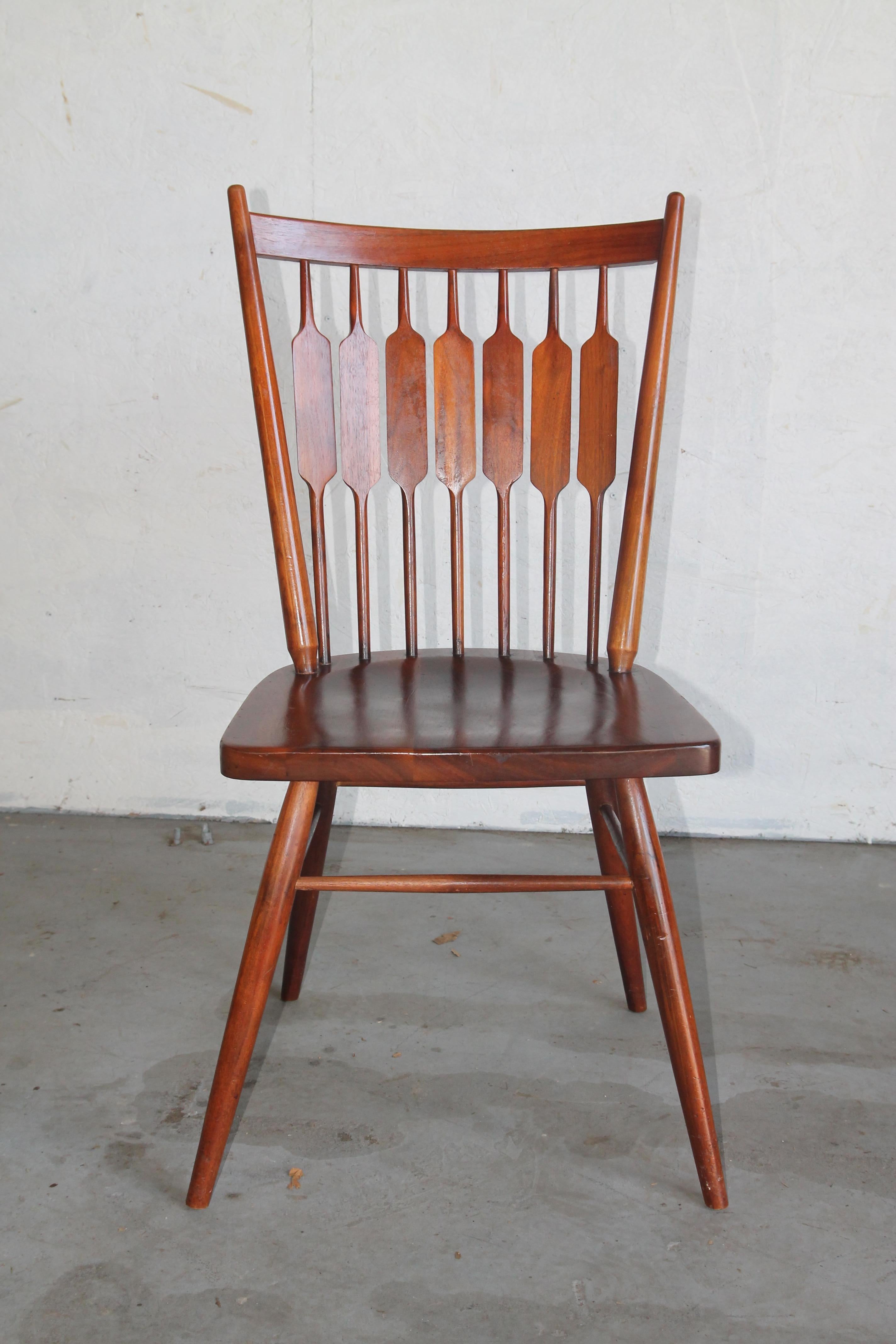 A set of 6 Drexel dining chairs by Kipp Stewart. These great looking walnut chairs were designed in the 1950s. In nice vintage condition. Set includes 4 side chairs and 2 arm chairs.