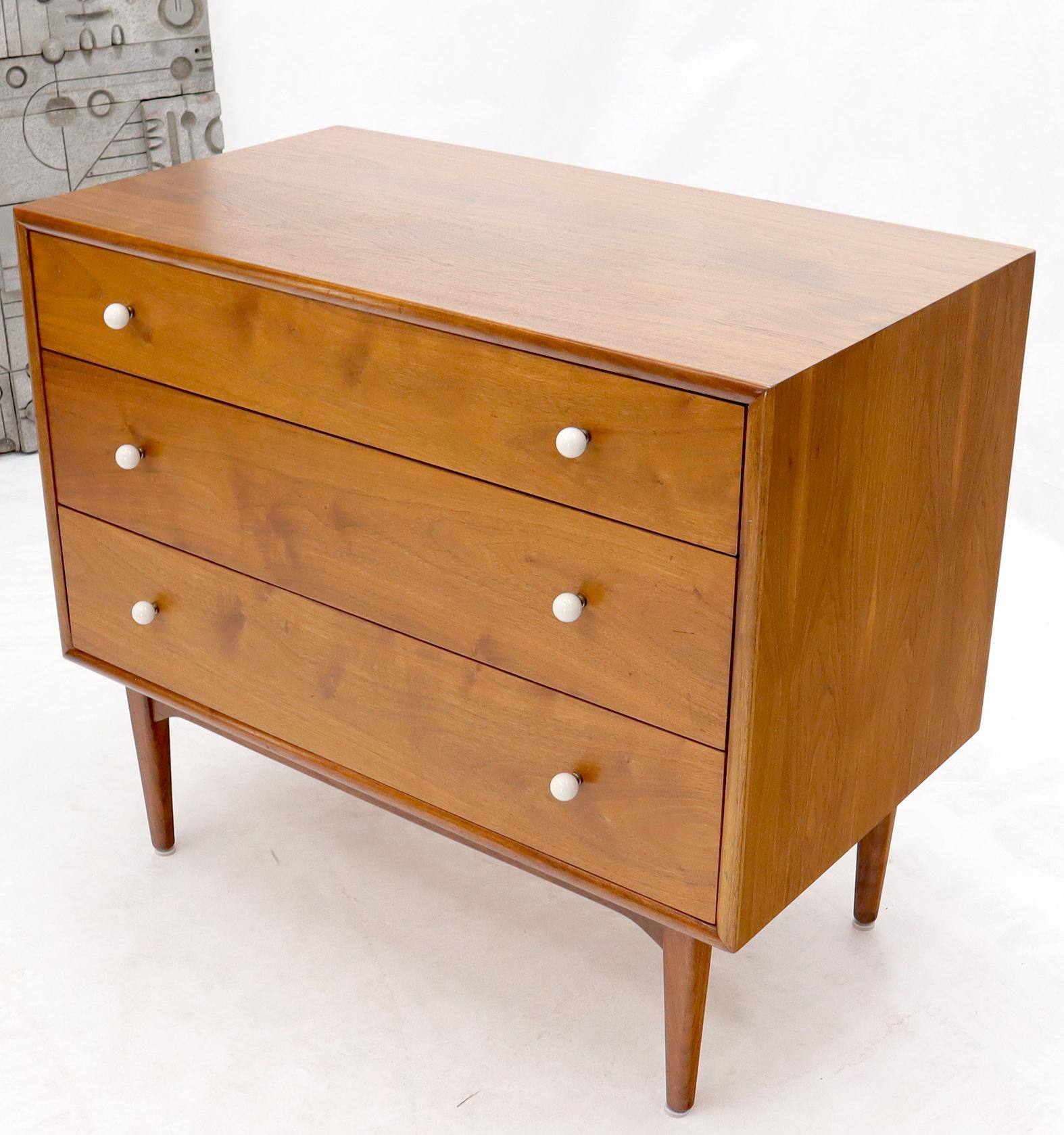 Mid-Century Modern walnut three drawer’s bachelor chest dresser with round porcelain pulls.