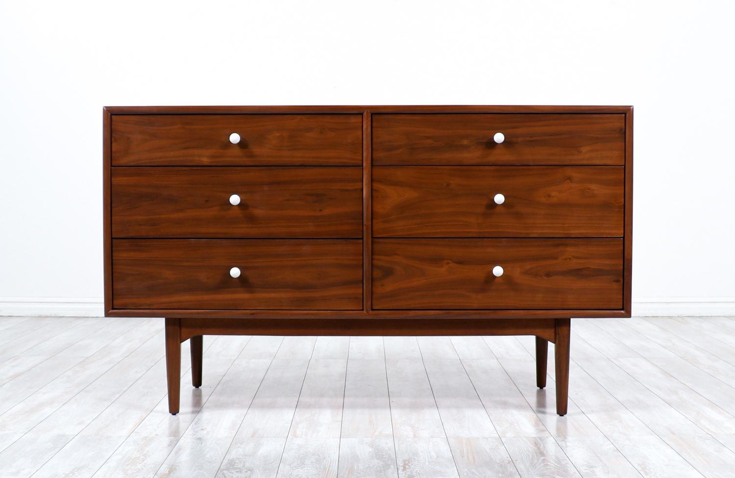 Splendid dresser designed by Kipp Stewart & Stewart MacDougall for Drexel’s Declaration line in the United States circa 1950’s. This beautiful dresser has been recently refinished by our expert team keeping its original pieces. It features six