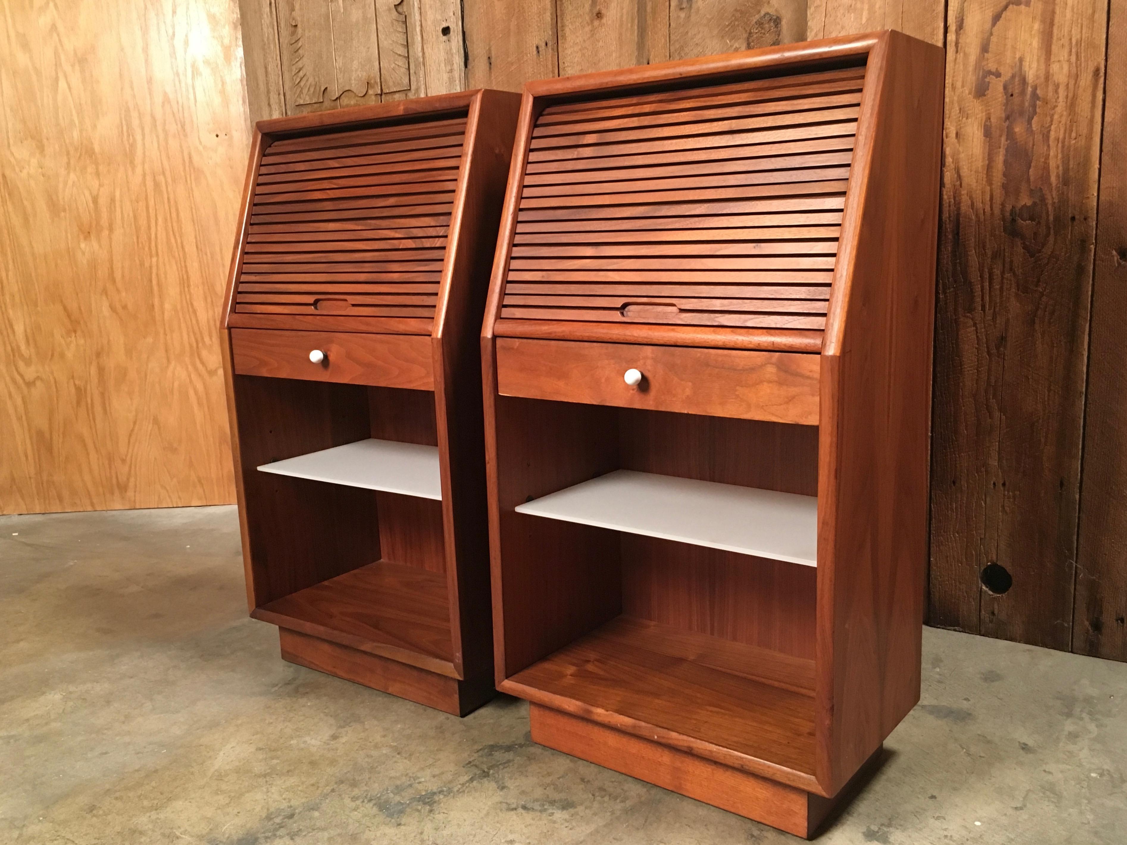 A pair of Kipp Stewart for Drexel declaration tambour door nightstands with original milk glass shelf.
 