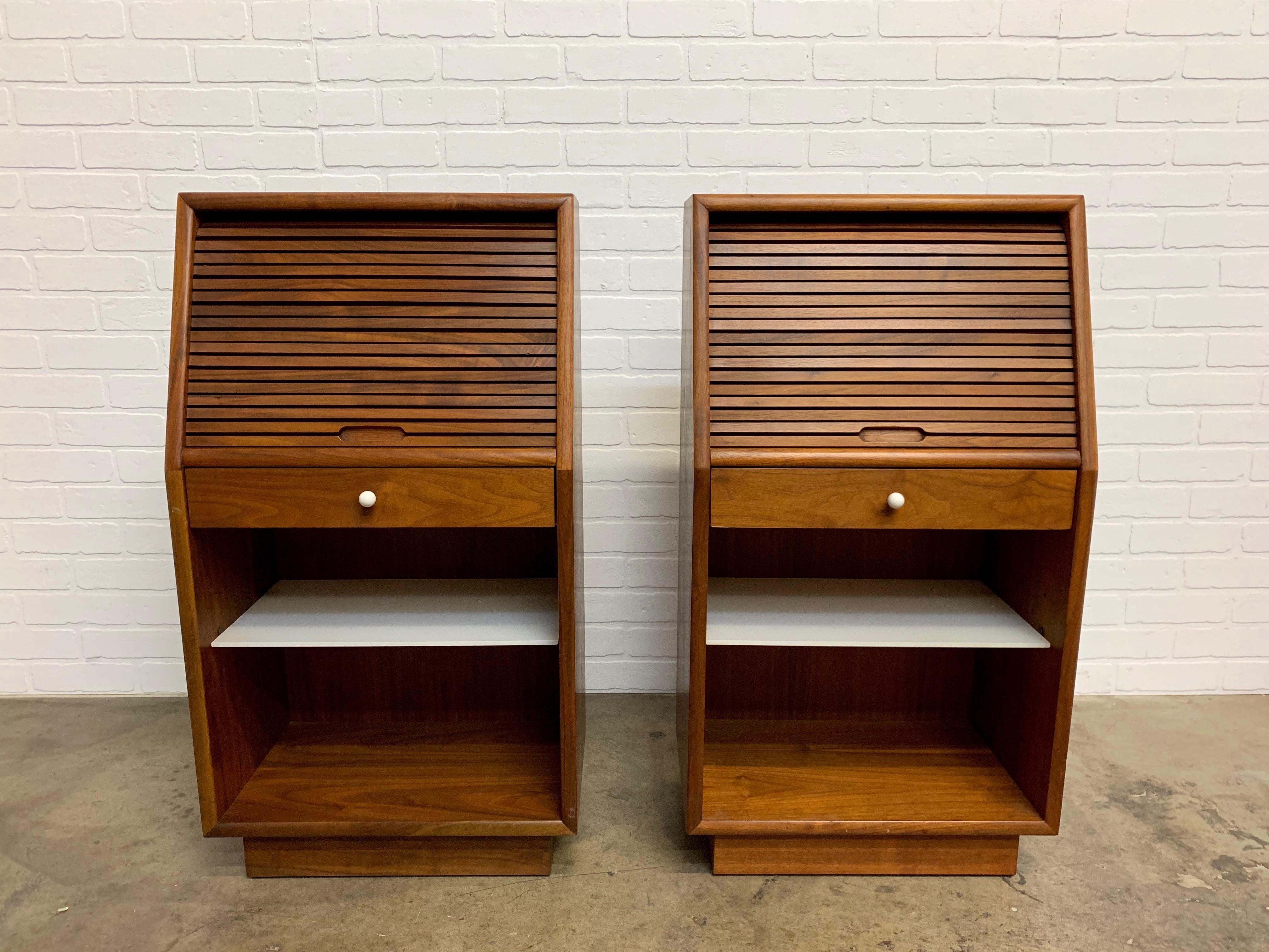 A pair of Kipp Stewart for Drexel Declaration tambour door nightstands with original milk glass shelf.
  