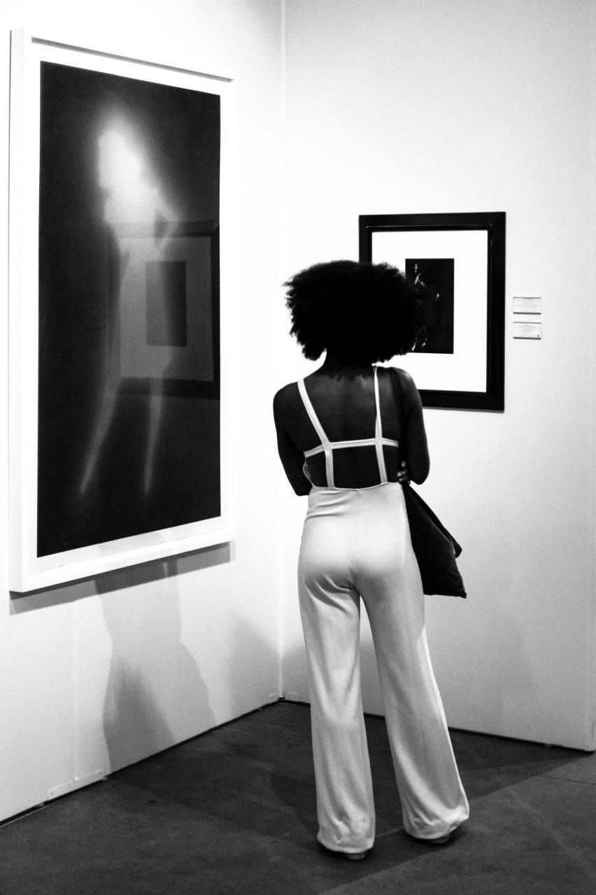 Kirill Polevoy Black and White Photograph - Woman and Art, Chicago, Framed Black and White Photo of Woman Looking at Art