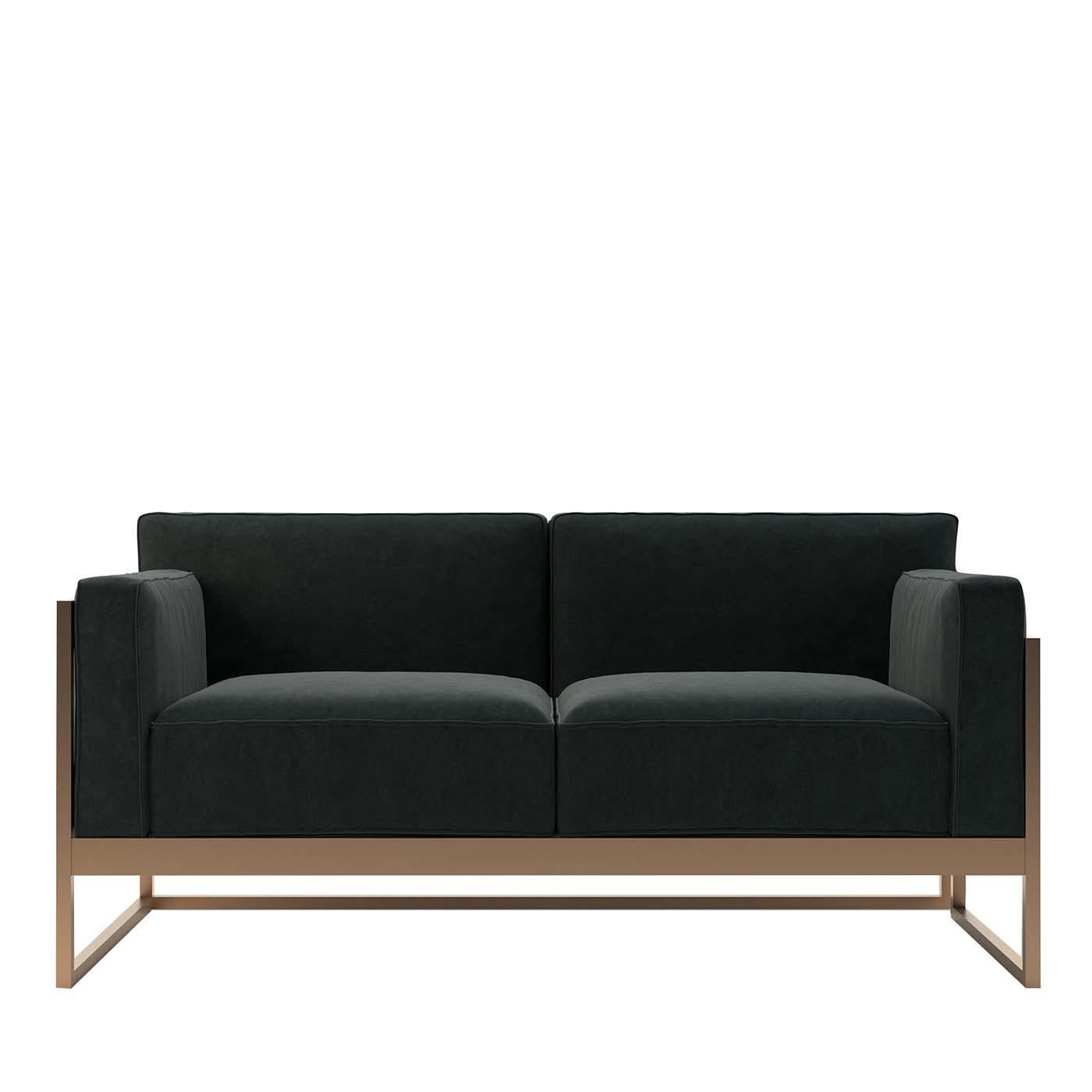 This sofa will be a refined and elegant accent to both residential and commercial interiors, such as hotel or resort living areas. Marked by a simple and sophisticated silhouette composed of rigorous lines, the two gunmetal velvet seats with back