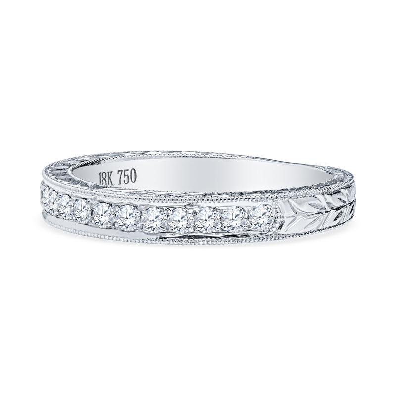This band from Kirk Kara features 0.20 carat total weight in round diamonds with milgrain and hand engraved detailing set in 18 karat white gold. This ring is a size 4.75 but can be resized upon request. 
Measurements: Width approximately 2.60mm -