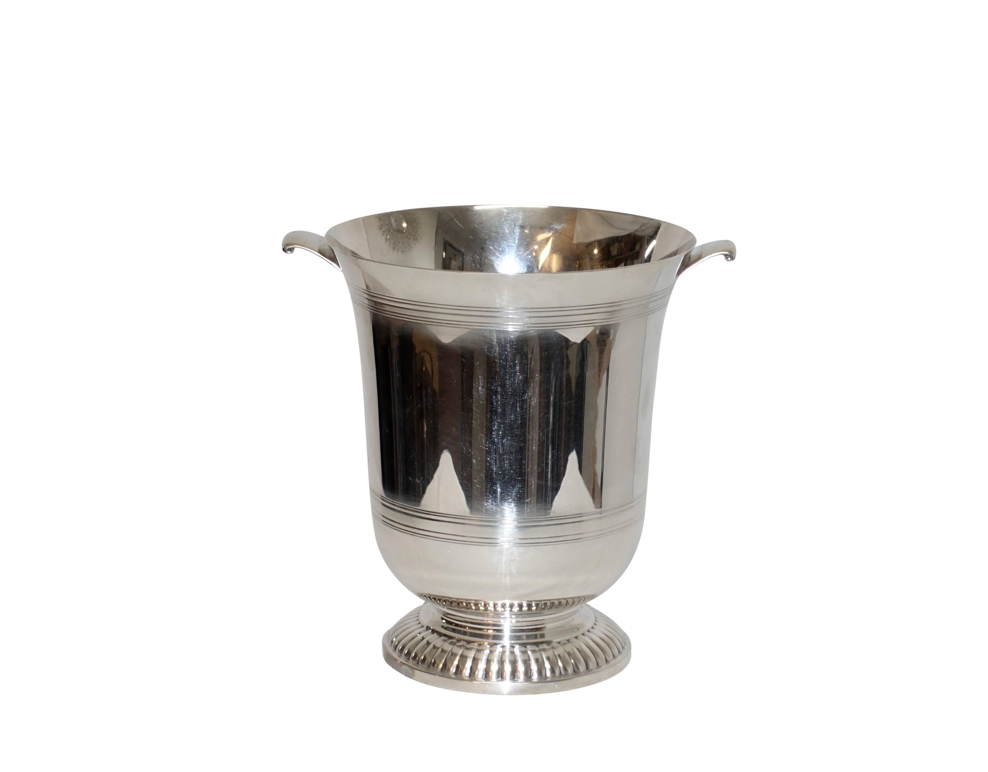 Understated elegance in the simplicity of the design on this sterling silver footed champagne/wine bucket or cooler, American, circa 1960.