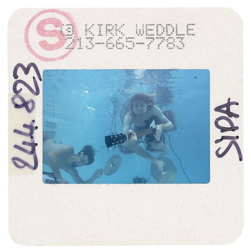 Signed print taken from an original color slide of Nirvana by Kirk Weddle. This slide was taken during the famous swimming pool sessions with Nirvana for the release of Nevermind in 1991, and photographed by Kirk to produce this series of