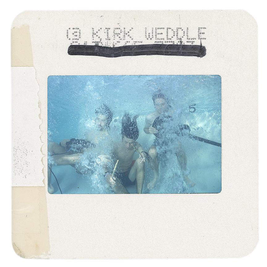 Signed print taken from an original color slide of Nirvana taken by Kirk Weddle. This slide was taken during the famous swimming pool sessions with Nirvana for the release of Nevermind in 1991, and photographed by Kirk to produce this series of