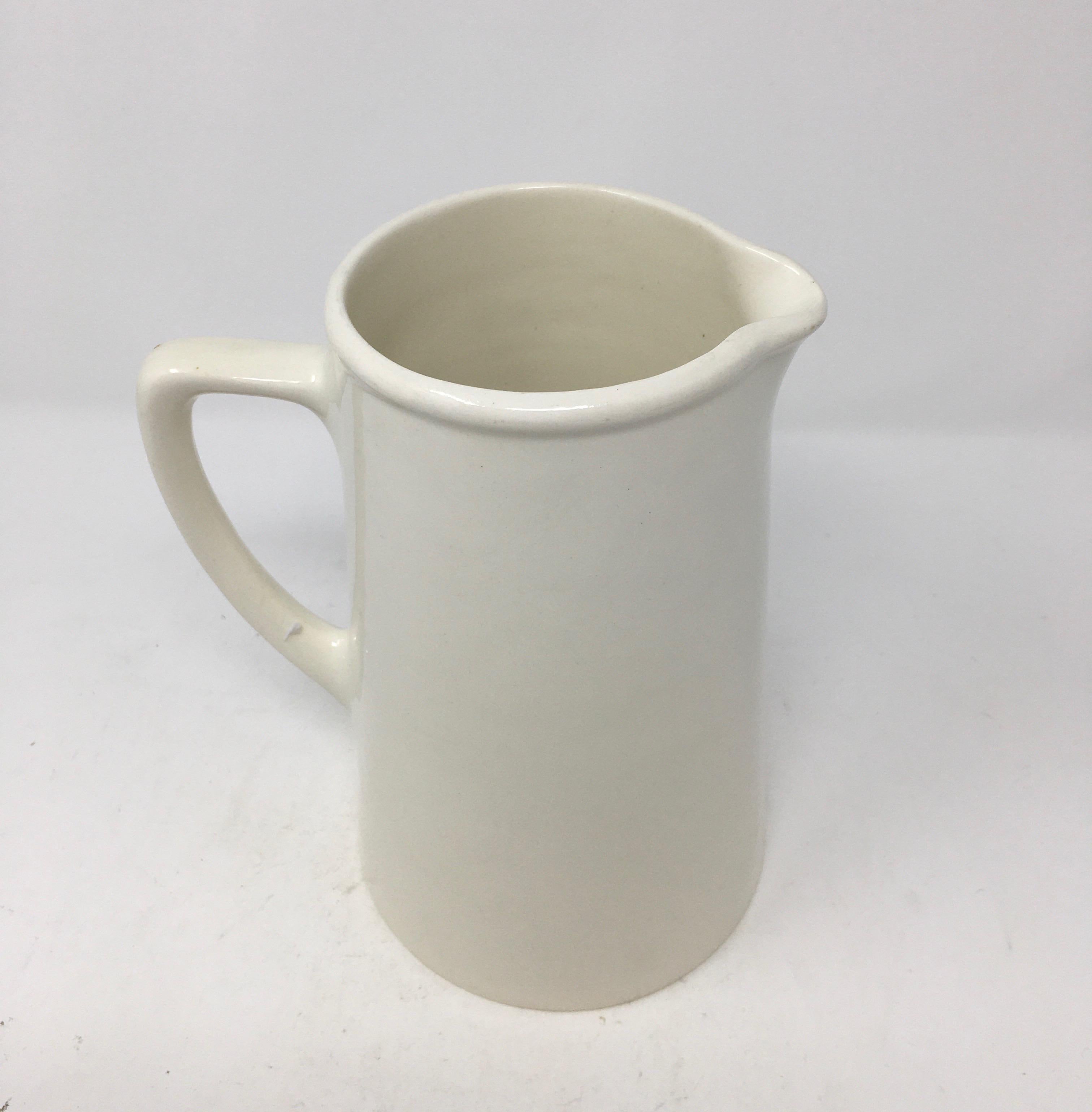 A lovely large early 20th century banded white ironstone pitcher, signed Kirkland Etruria Embassy Ware and stamped England on the bottom. This beautiful pitcher has simple clean lines, perfect for any decor. It would be a wonderful addition to a