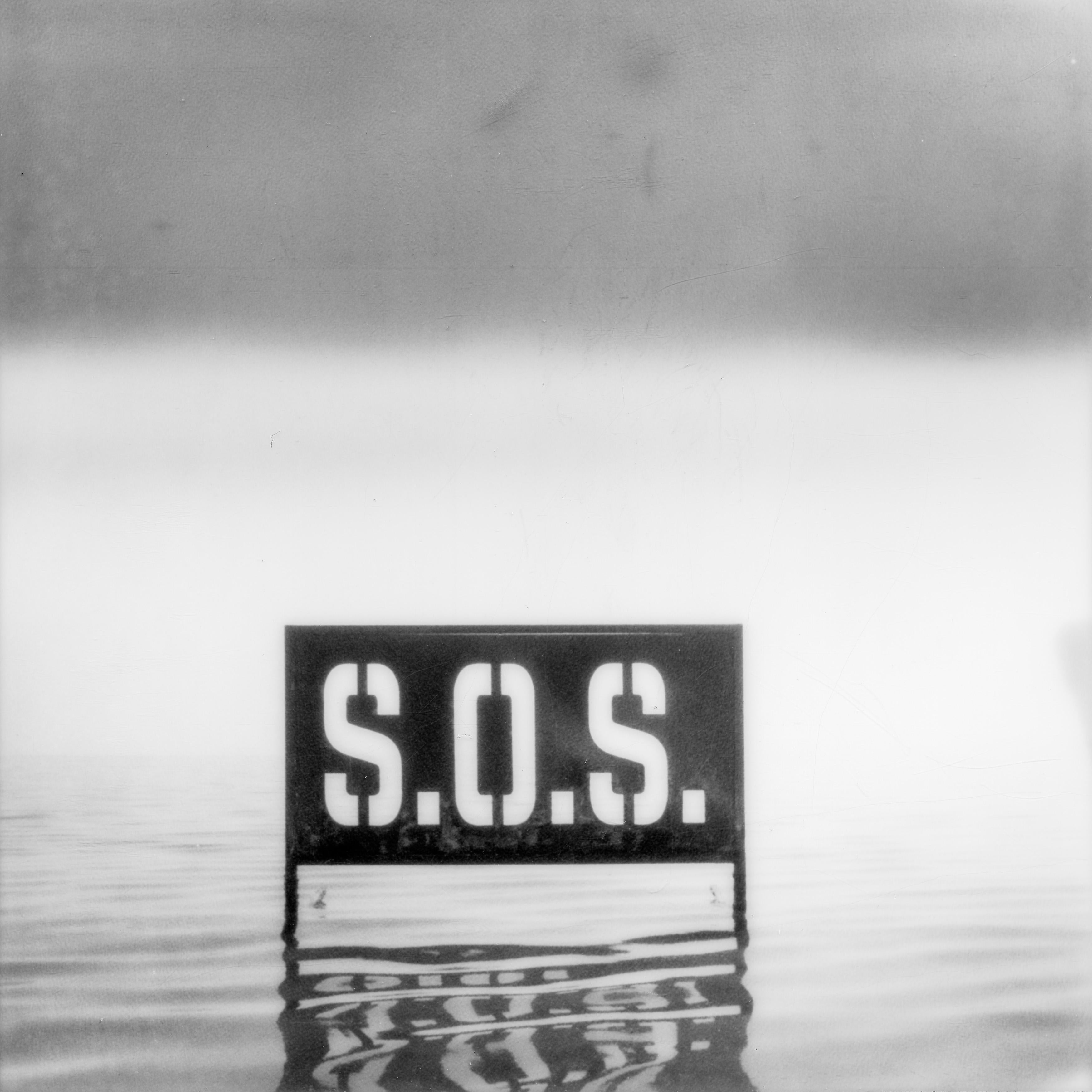 Kirsten Thys van den Audenaerde Black and White Photograph - SOS (Bombay Beach, CA) - Polaroid, Landscape Photography