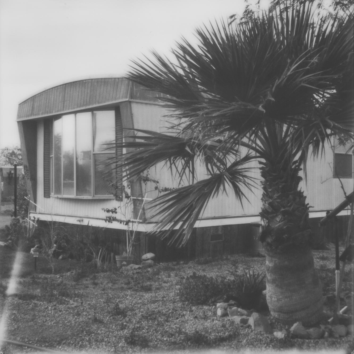 Kirsten Thys van den Audenaerde Black and White Photograph - Trailer Life (Bombay Beach)- 21st Century, Polaroid, Landscape, Photography