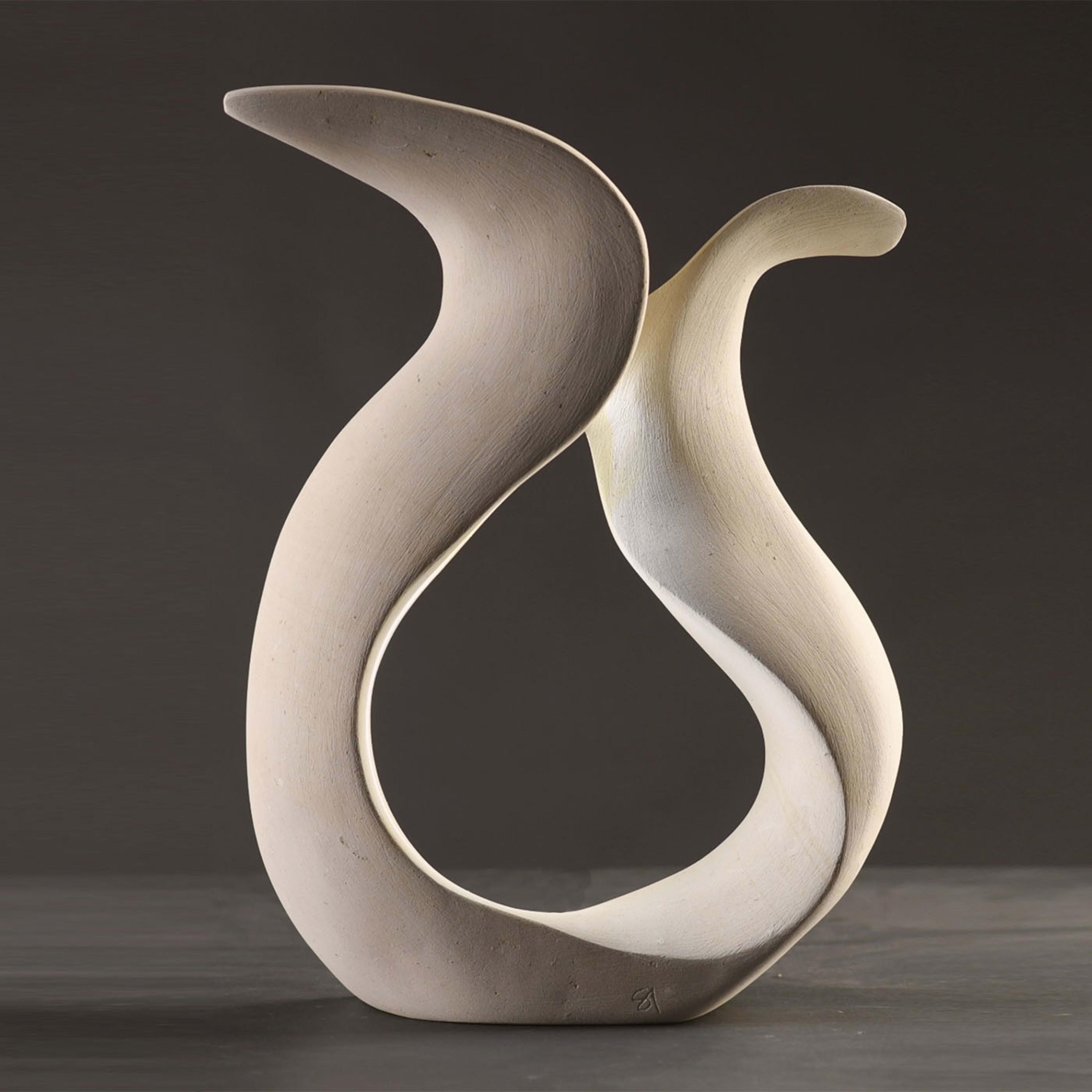 Sensuality and emotion actualized in sinuous curves seemingly shaped by the wind define this superb sculpture of unmistakable contemporary inspiration. Incorporating a warm white LED strip - color customizable upon request - the piece gets minutely