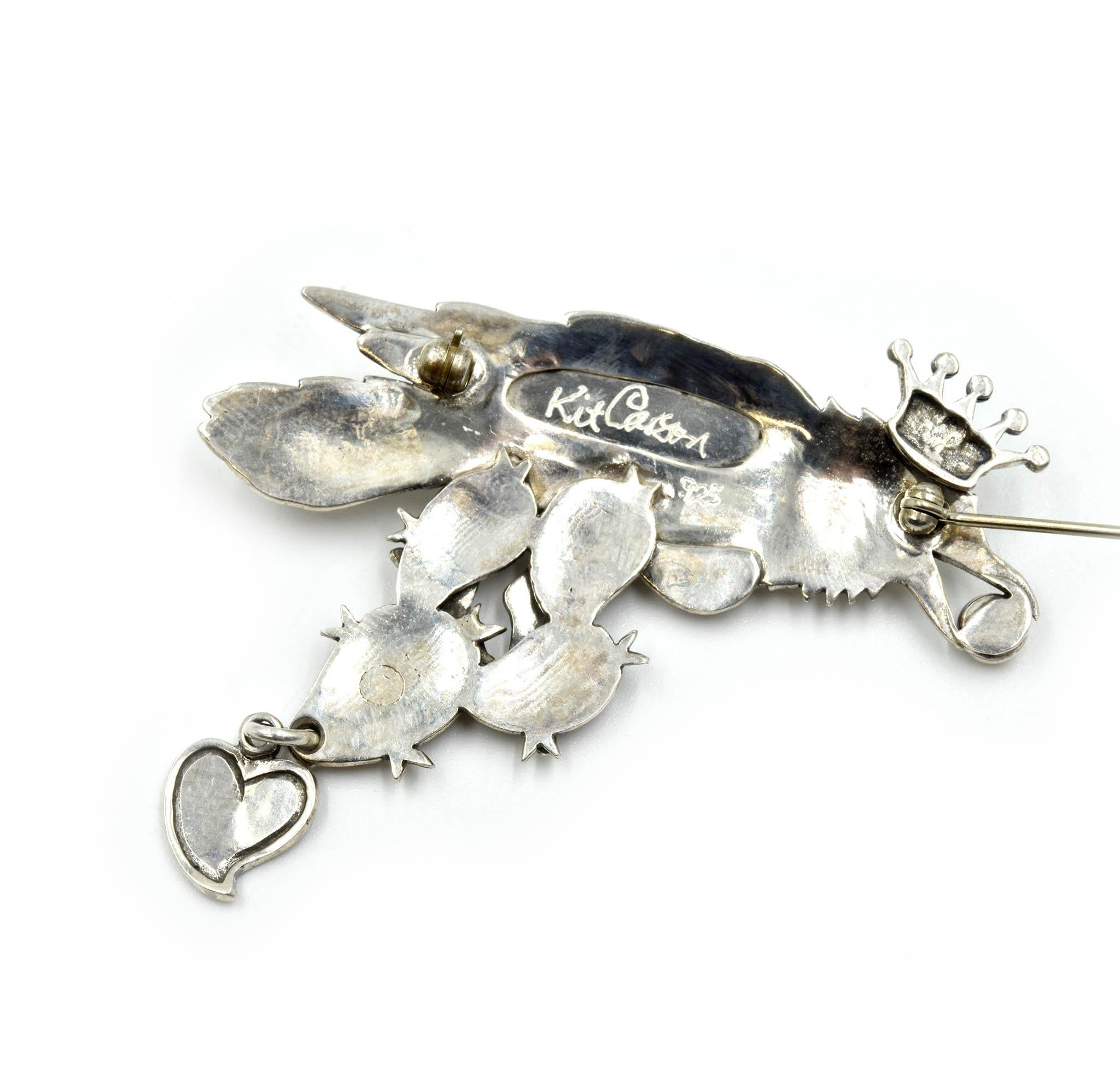 Designer: Kit Carson
Material: sterling silver
Dimensions: Kit Carson pin measures 2 1/4-inches long and 2 inches-wide
Weight: 12.70 grams
Retail: $385
