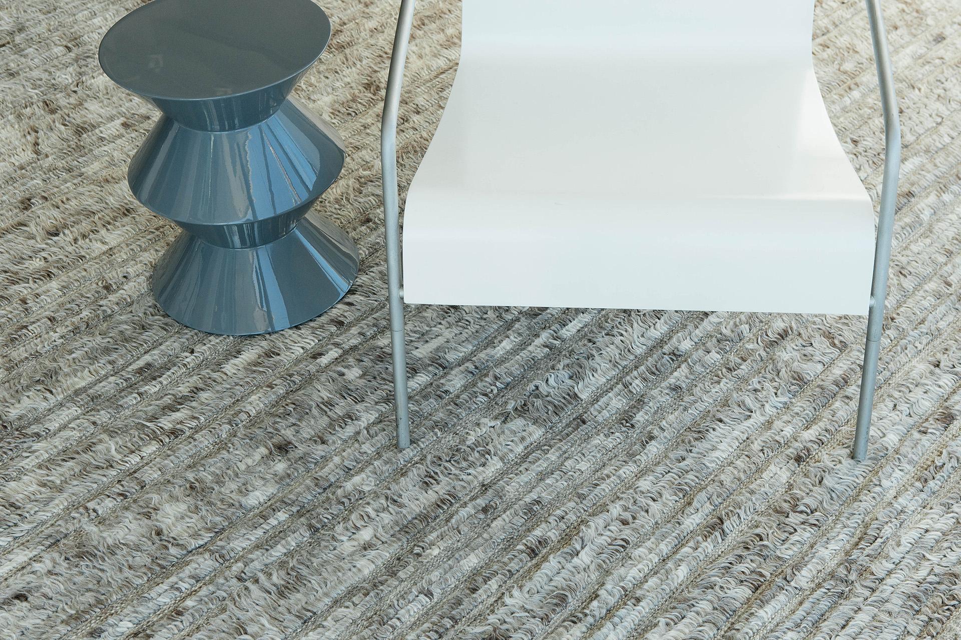 Kit Moresby' has become an LA staple. The signature rug of Malibu. Handwoven of luxurious wool, with timeless design elements and color palette. This Mehraban design is a contemporary interpretation of an Azilal, a part of our Atlas collection.