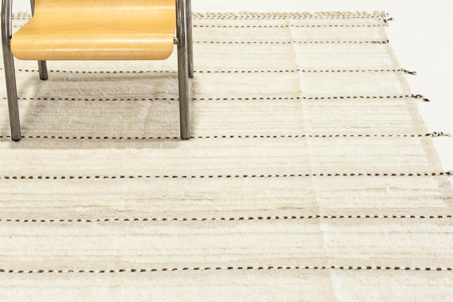 'Kit Moresby' has become an LA staple and the signature rug of Malibu. Handwoven of luxurious wool, with timeless design elements and a neutral color palette. This Mehraban design is a contemporary interpretation of an Azilal, a part of our Atlas