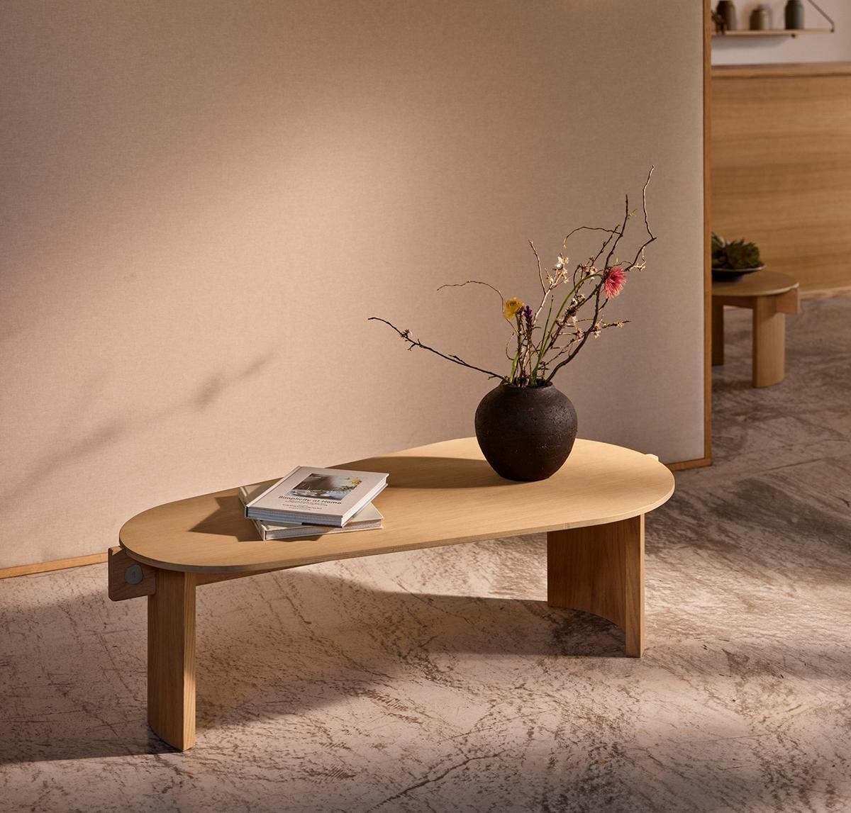 Flow Coffee Table Medium with rounded edges, contours its asymmetrical elliptical form by curved two legs. The linear skeleton joins into the legs to create a well-proportioned base for the table top.

Crafted from oak wood, the low piece awakens a