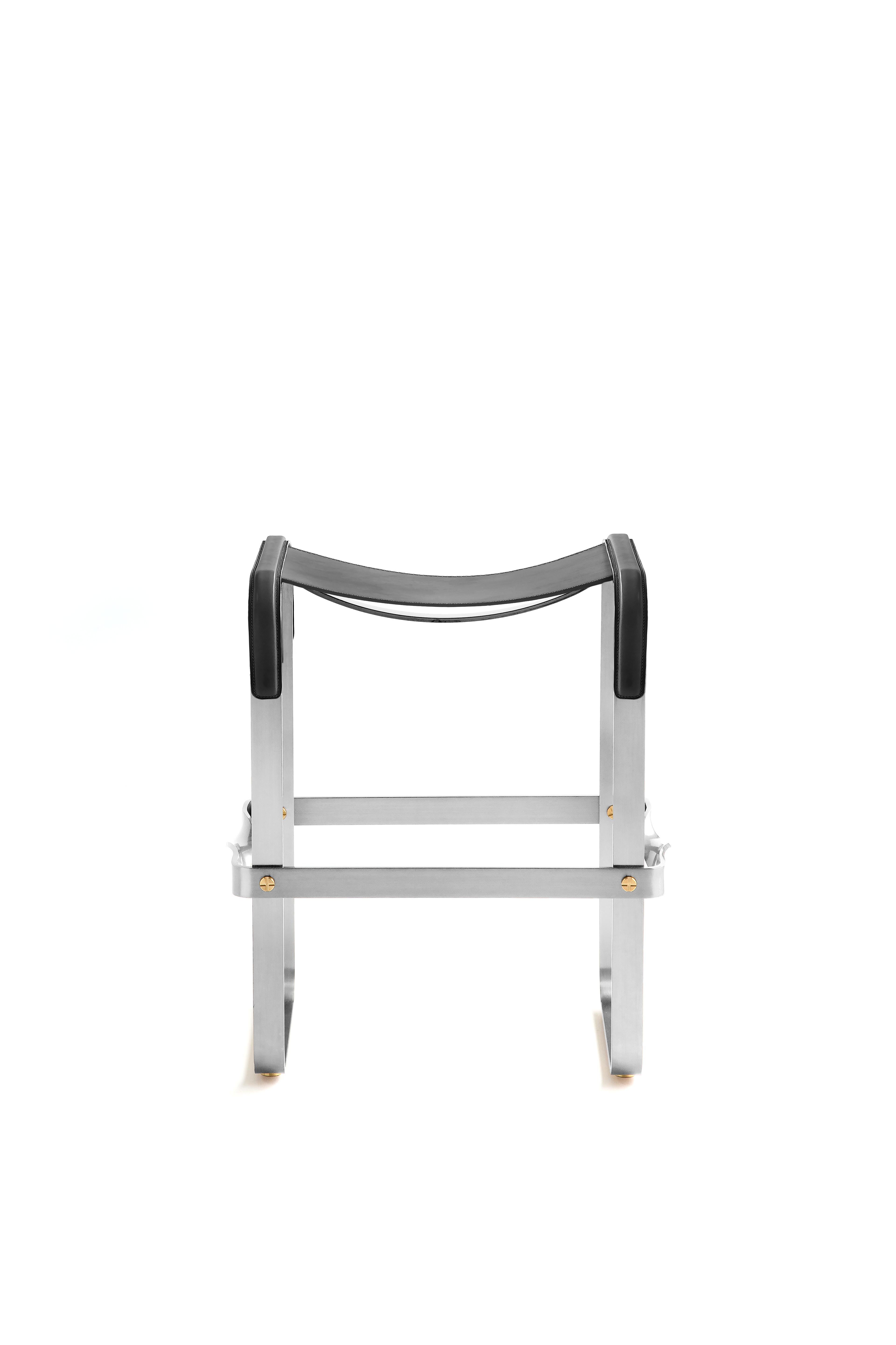 The Wanderlust contemporary counter stool belongs to a collection of minimalist and serene pieces where exclusivity and precision are shown in small details such as the hand-turned metal nuts and bolts that fix the leather surfaces, that go