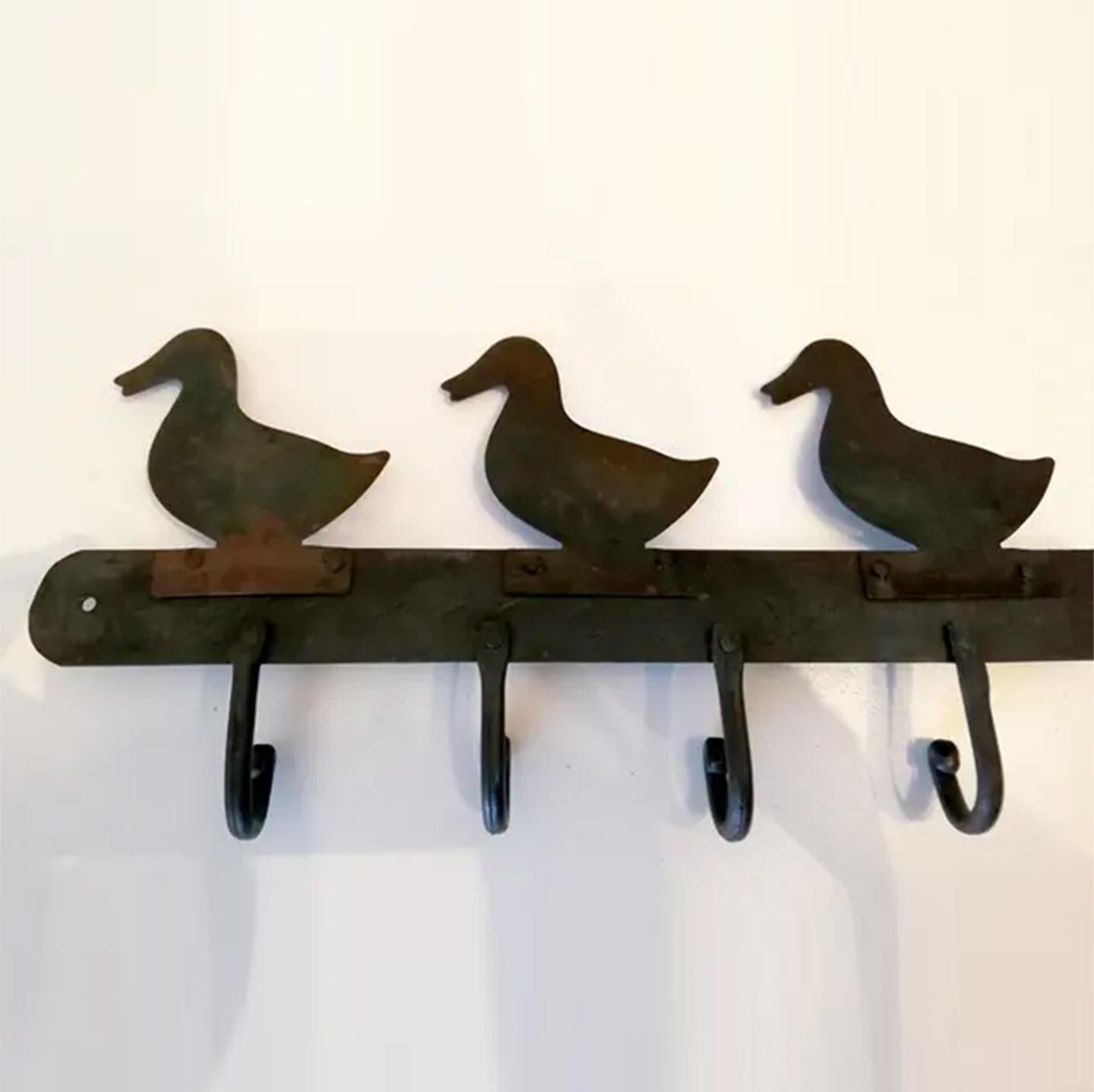 Ducks shaped handmade iron kitchen hanger

Handmade hanger to hang utensils or kitchen towels or as a hanger to hang other utensils. This old coat hanger, coat rack or hanger can also be used as a hanger to hang anything, coat, umbrella, hats

 