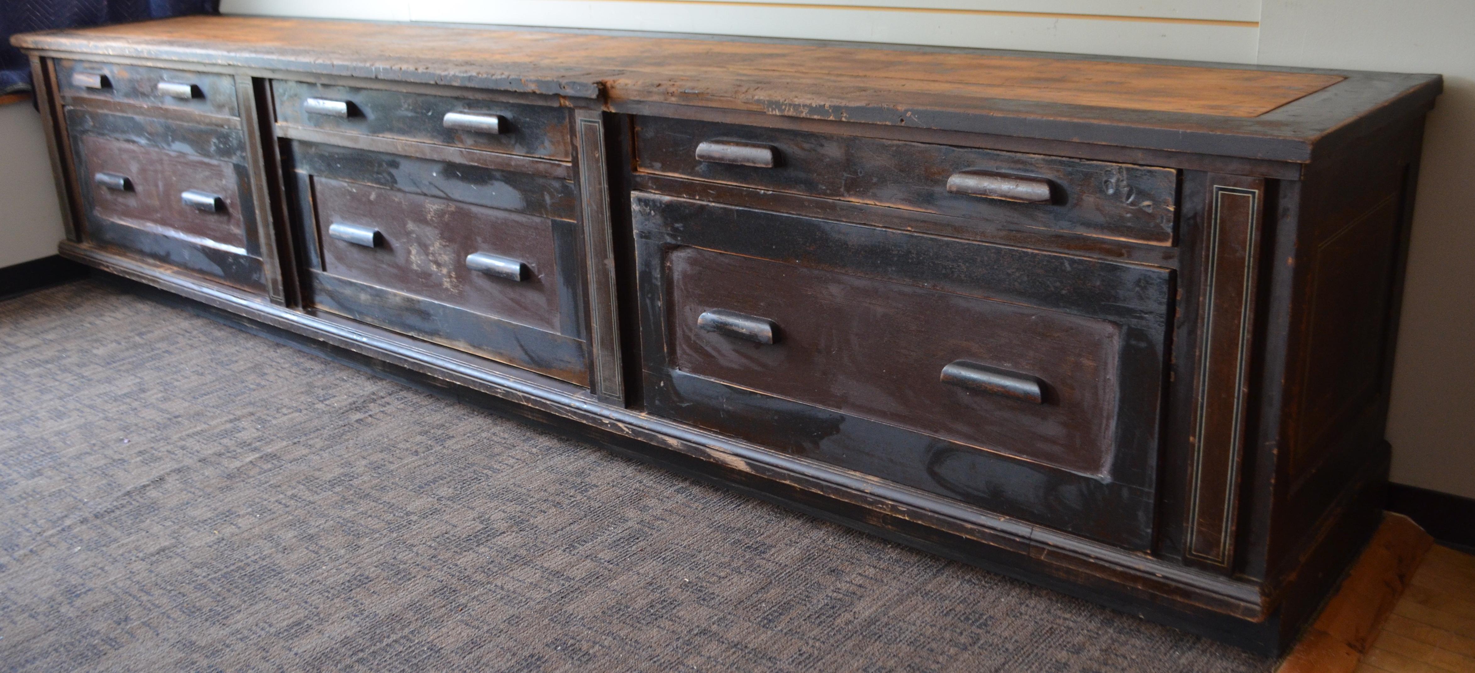 Impressive 12.5' long kitchen island from country store counter out of an 1850s farm in central Maine. Counter served as a work and storage unit in the barn of that Yankee farmstead for decades as evidenced by the amazing patina and character marks
