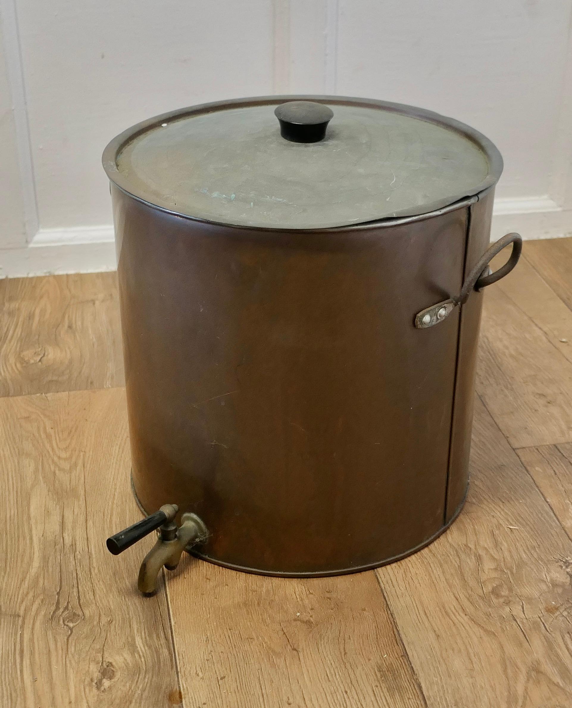 Kitchen Range Copper Hot Water Urn Samovar

This very practical piece has been tinned inside the Copper body with brass banding, iron handles it has a copper lid and a brass tap 
In good original condition, decorative, ideal for display or storage