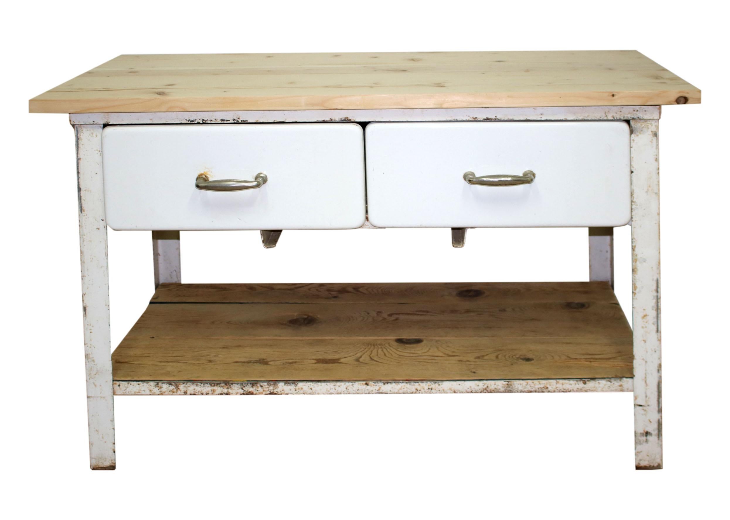 This kitchen work table mirrors the design of the period in which it was produced. It provides ample storage for kitchen tools and utensils. The wooden worktop provides a very comfortable space for kitchen staff. The drawerd are enameled with white