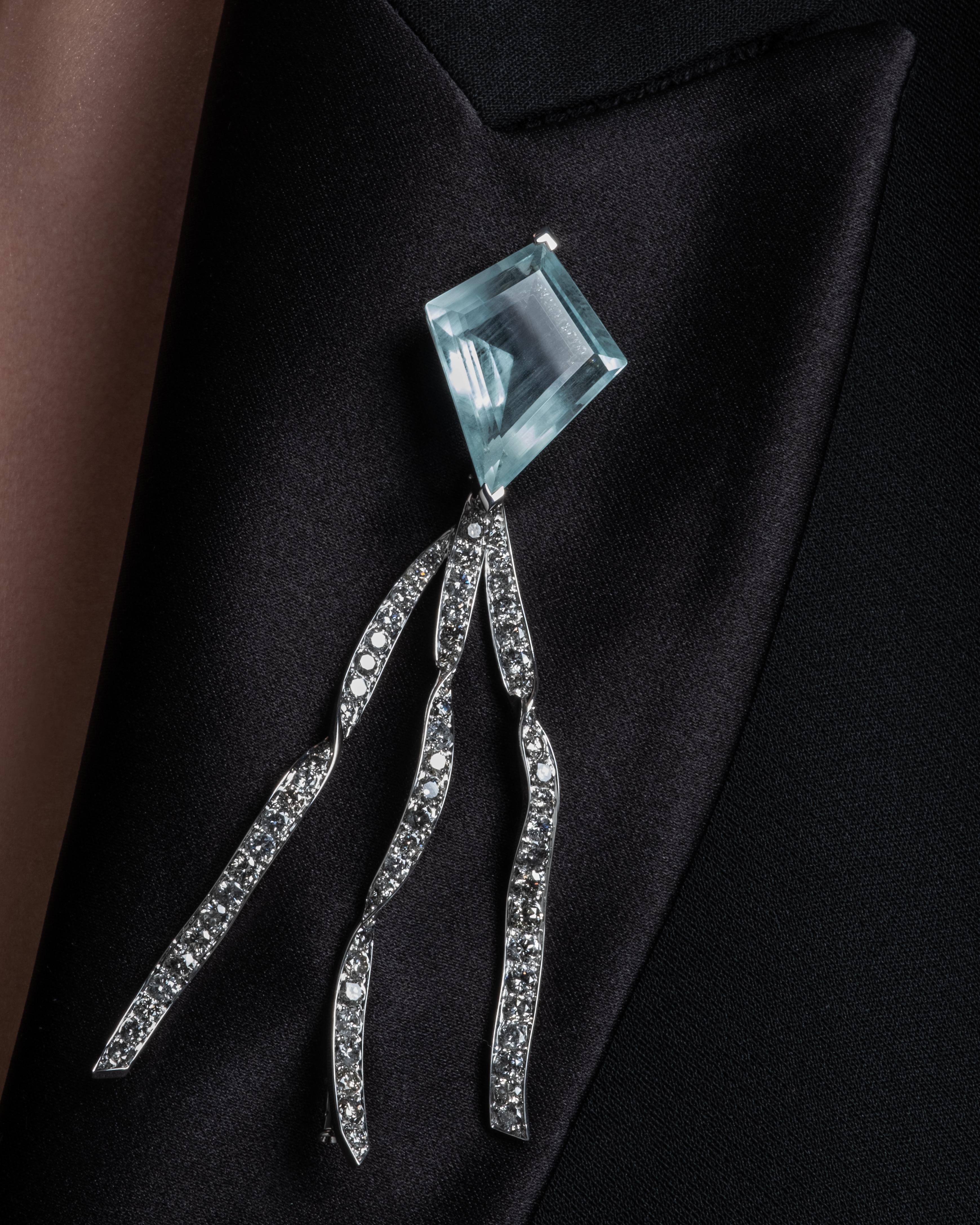 This imaginative Aquamarine and Diamond brooch features pure artistry inspired by the limitless beauty beyond our imagination, personal freedom, and ultimate happiness through devotion and unwavering faith, giving this kite brooch a powerful