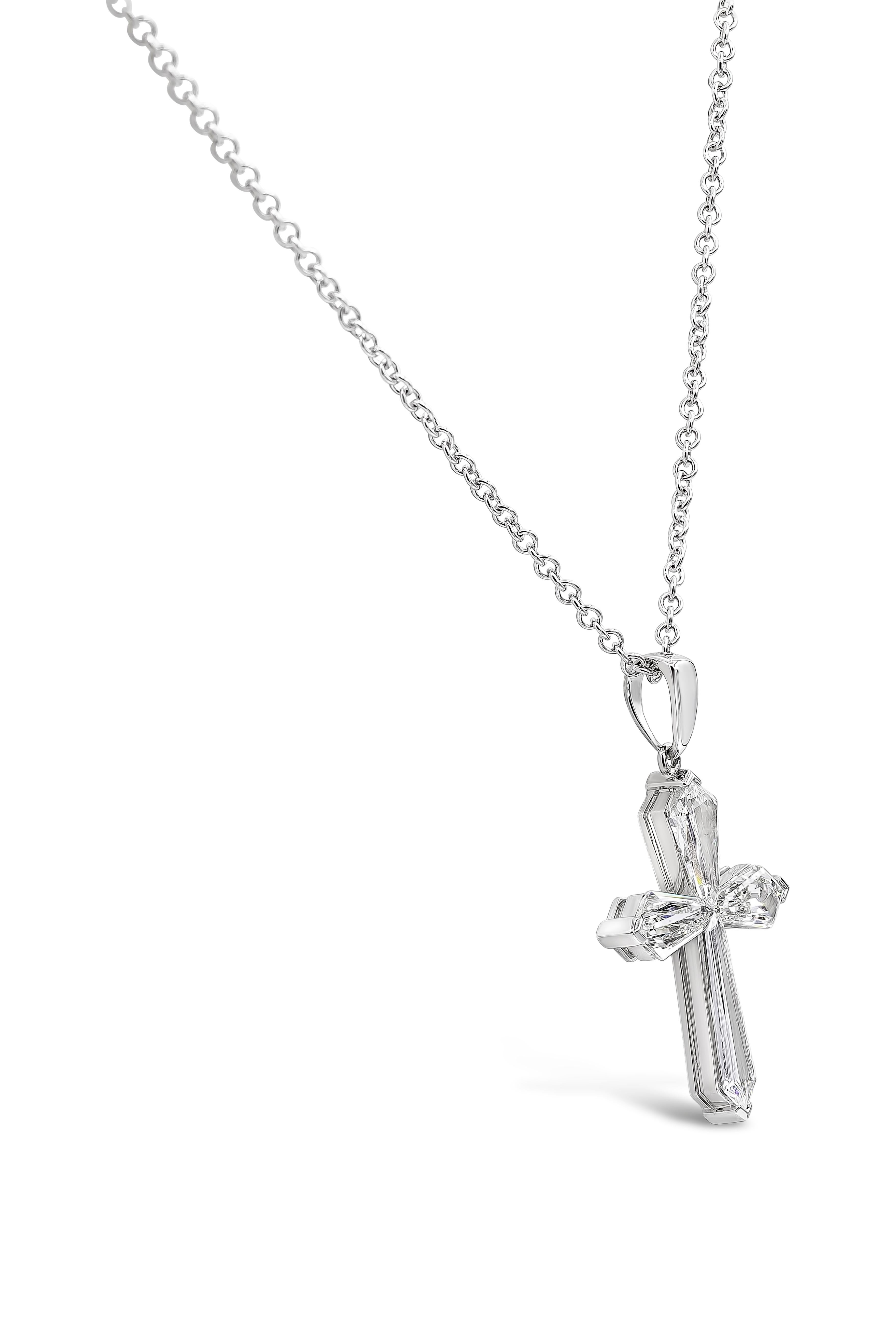 A beautiful cross pendant showcasing uniquely-cut Kite diamonds to shape the pendant in to a cross design. Set in 18k white gold. Diamonds weigh 1.86 carats total and are approximately E-F color, VS-SI clarity. 

