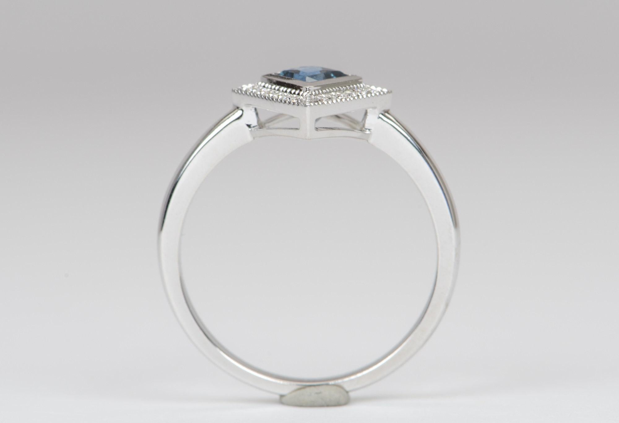 ♥  Solid 14K gold ring set with a kite shaped Montana sapphire in the center, flanked with a diamond halo.
♥  The ring is lined with delicate hand-engraved milgrain edges for a vintage-inspired look.
♥  The overall setting measures 10.6mm in width,
