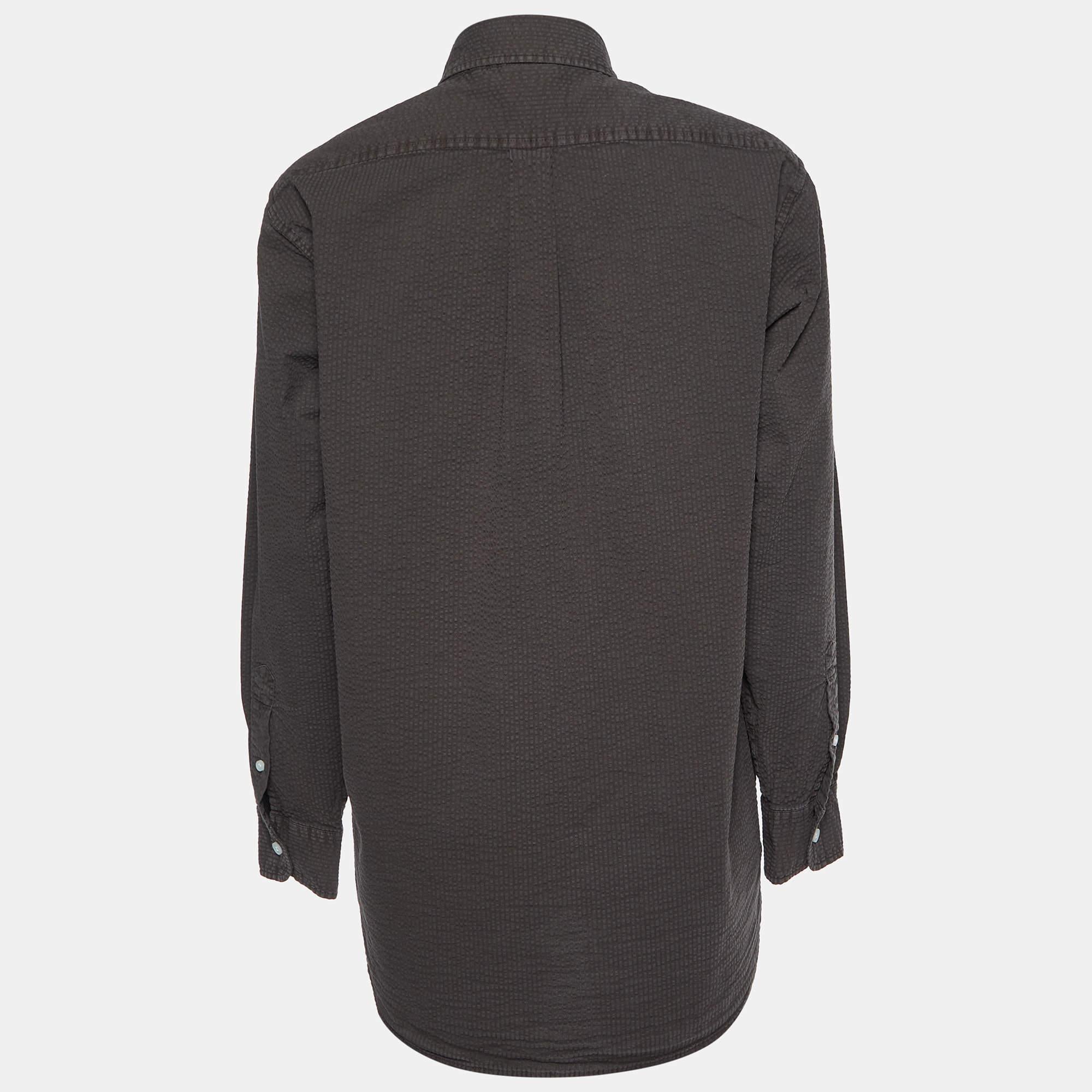 Crafted with precision this Kith brown shirt blends luxury and functionality effortlessly. Elevate your casual look with this fashion forward essential.