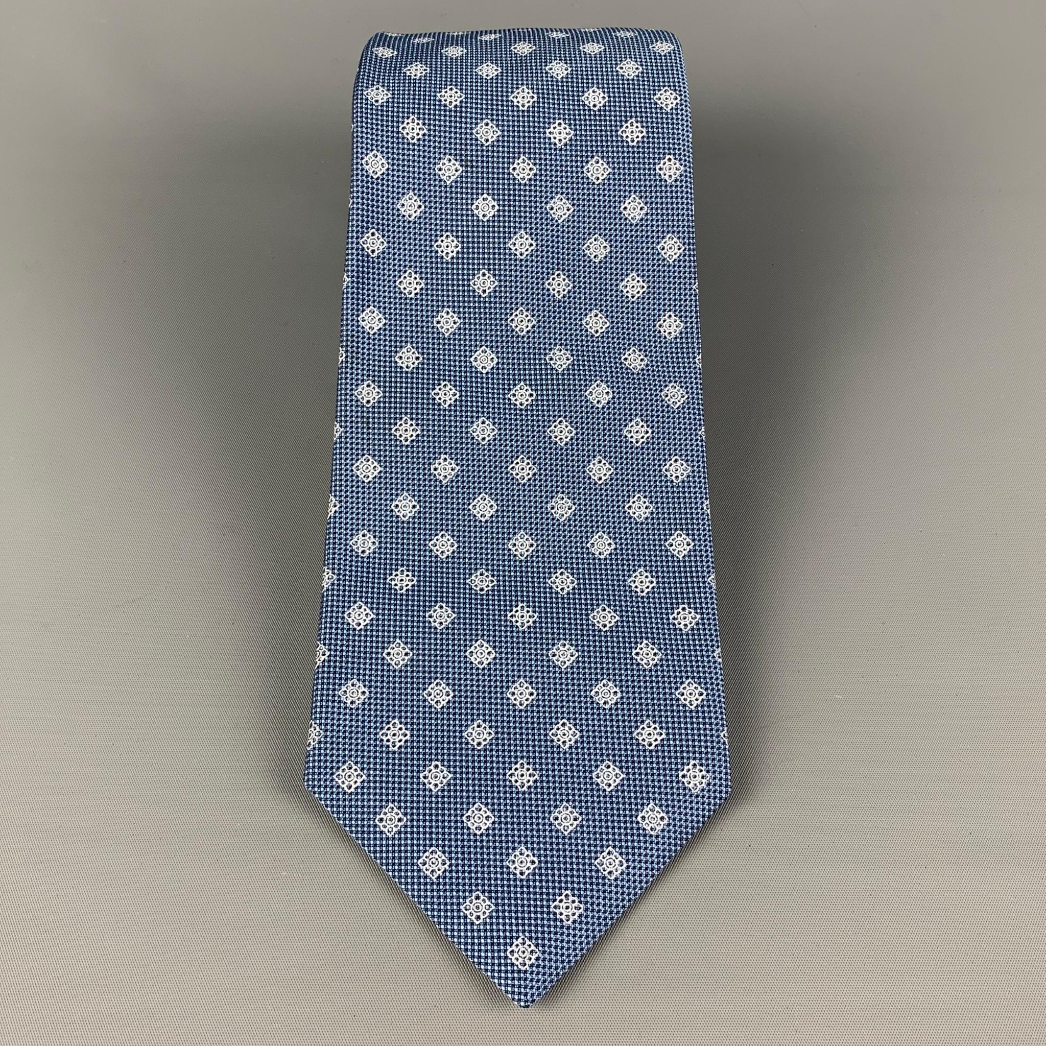 KITON necktie comes in a blue & white silk with a all over rhombus print. Made in Italy .

Very Good Pre-Owned Condition.
Original Retail Price: $345.00

Width: 3.75 in.
Length: 60 in. 