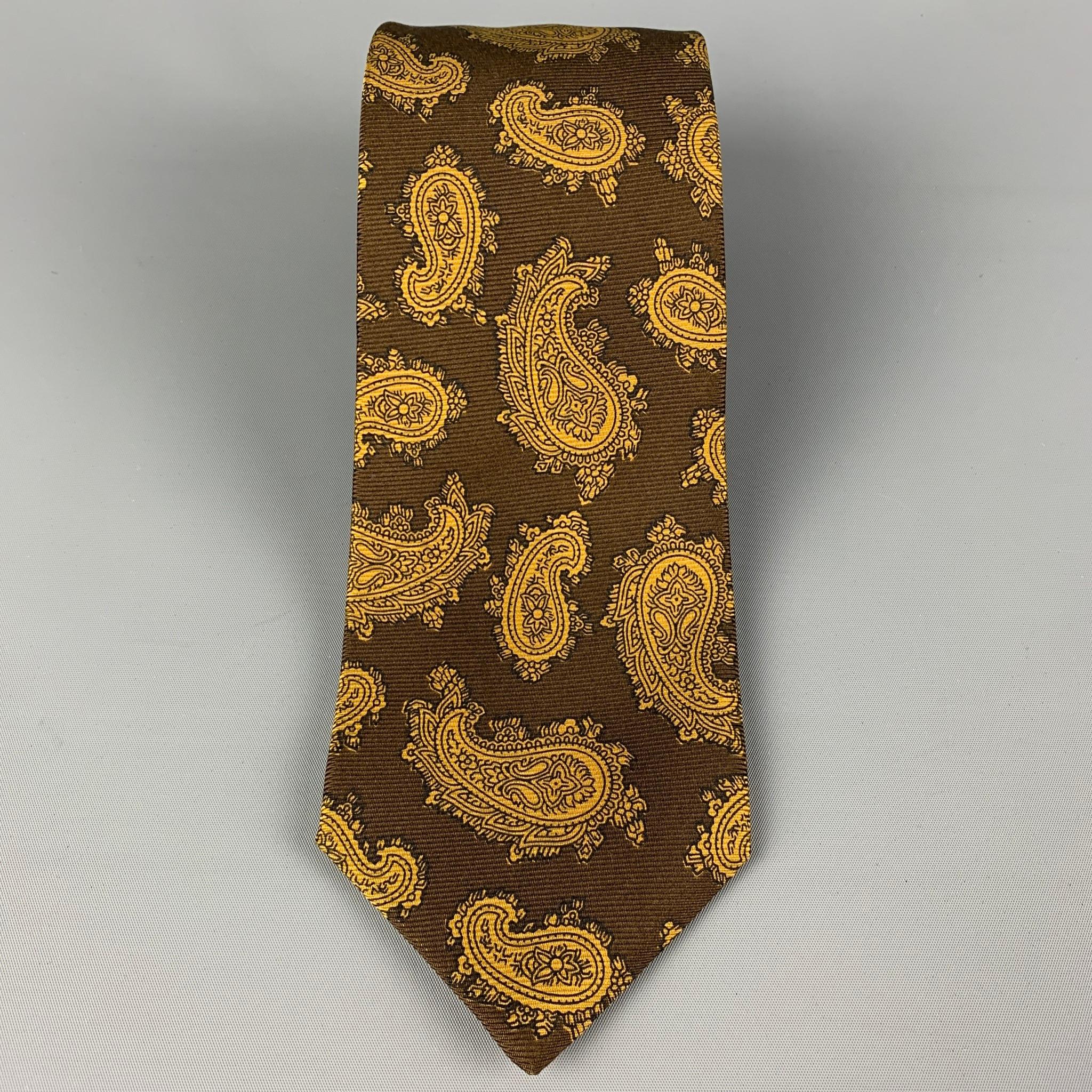 KITON necktie comes in a brown & mustard silk with a all over paisley print. Made in Italy .

Very Good Pre-Owned Condition.
Original Retail Price: $345.00

Width: 4 in.
Length: 60 in. 

 