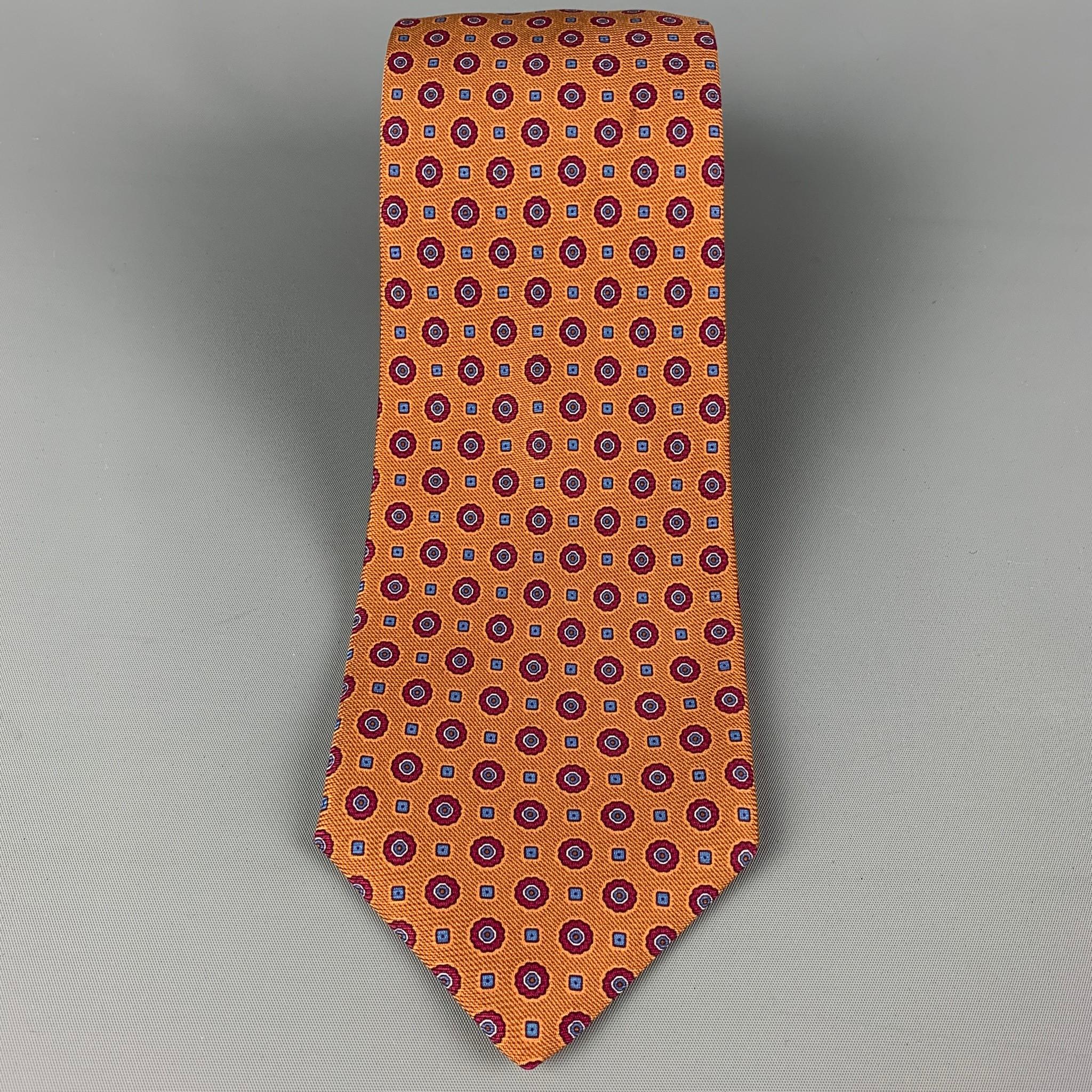 KITON necktie comes in a copper & burgundy silk with a all over dot print. Made in Italy .

Very Good Pre-Owned Condition.
Original Retail Price: $345.00

Width: 4 in.
Length: 62 in. 