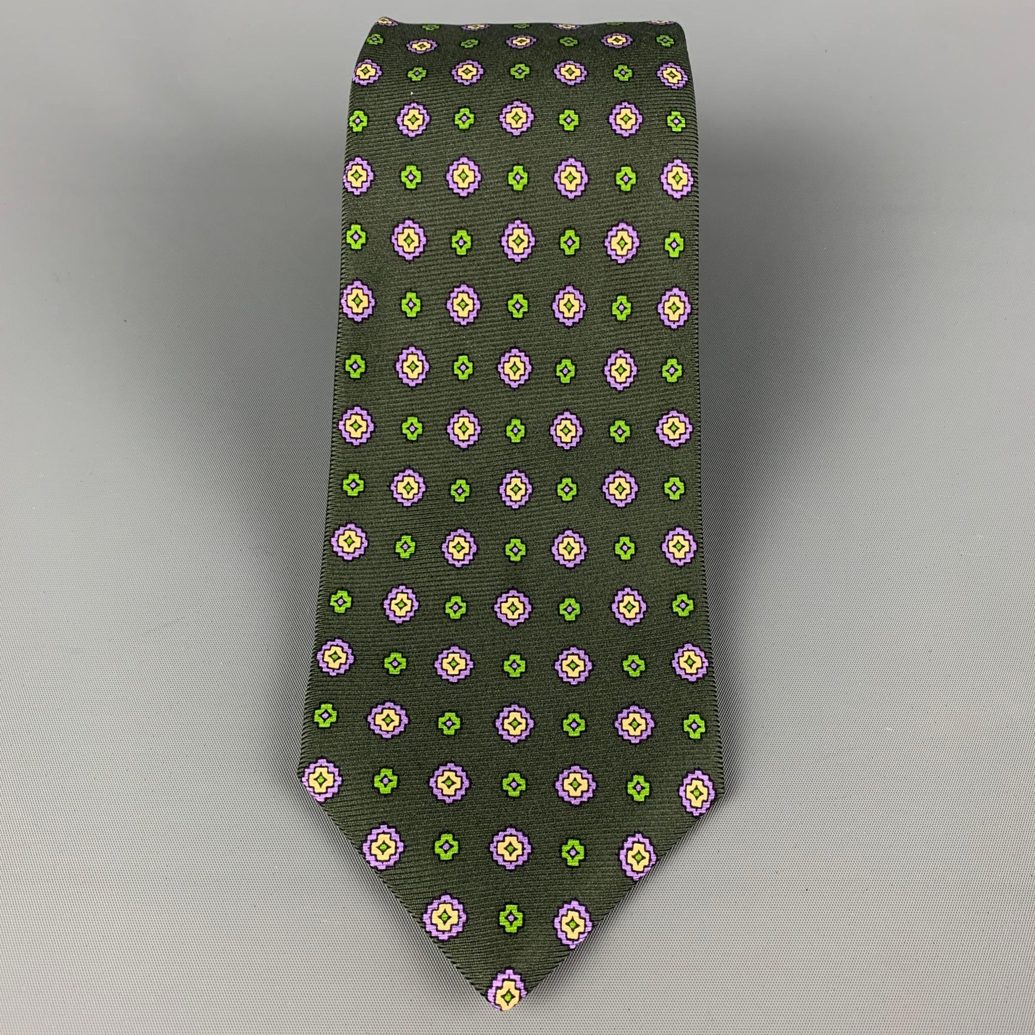 KITON necktie comes in a dark green & purple  silk with a all over abstract floral print. Made in Italy .

Very Good Pre-Owned Condition.
Original Retail Price: $345.00

Width: 4 in.
Length: 61 in. 

 